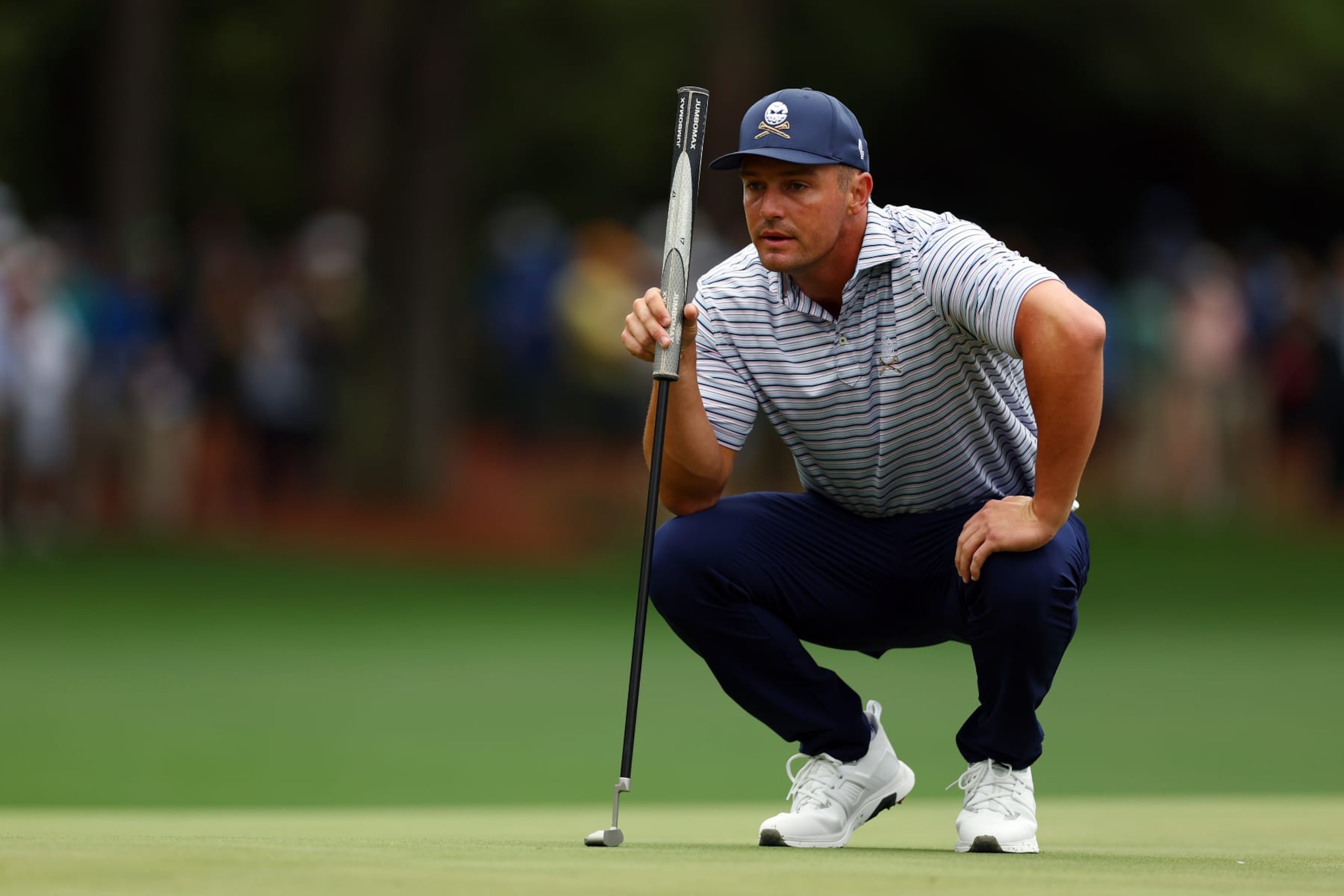AUGUSTA, GEORGIA - APRIL 11: Bryson DeChambeau of the United States lines up a putt on the first green during the first round of the 2024 Masters Tournament at Augusta National Golf Club on April 11, 2024 in Augusta, Georgia.  (Photo by Maddie Meyer/Getty Images)