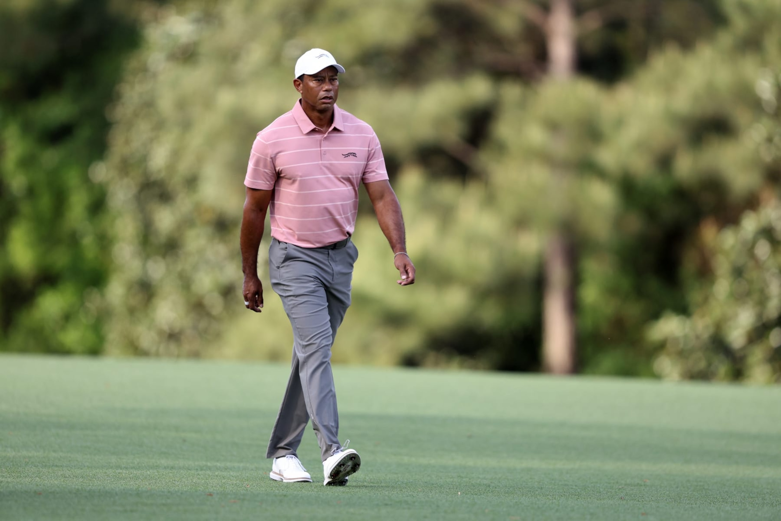 AUGUSTA, GEORGIA - APRIL 11: Tiger Woods of the United States walks the fifth fairway during the first round of the 2024 Masters Tournament at Augusta National Golf Club on April 11, 2024 in Augusta, Georgia.  (Photo by Warren Little/Getty Images)