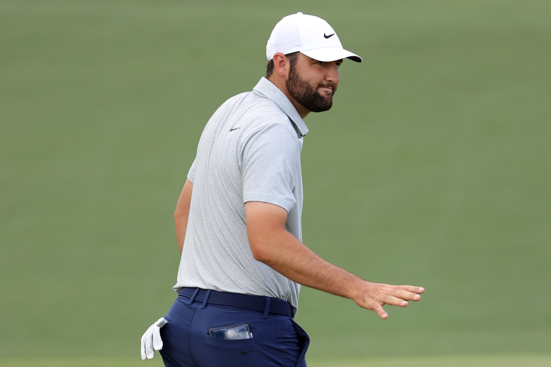 AUGUSTA, GEORGIA - APRIL 11: Scottie Scheffler of the United States reacts on the second green during the first round of the 2024 Masters Tournament at Augusta National Golf Club on April 11, 2024 in Augusta, Georgia.  (Photo by Jamie Squire/Getty Images)