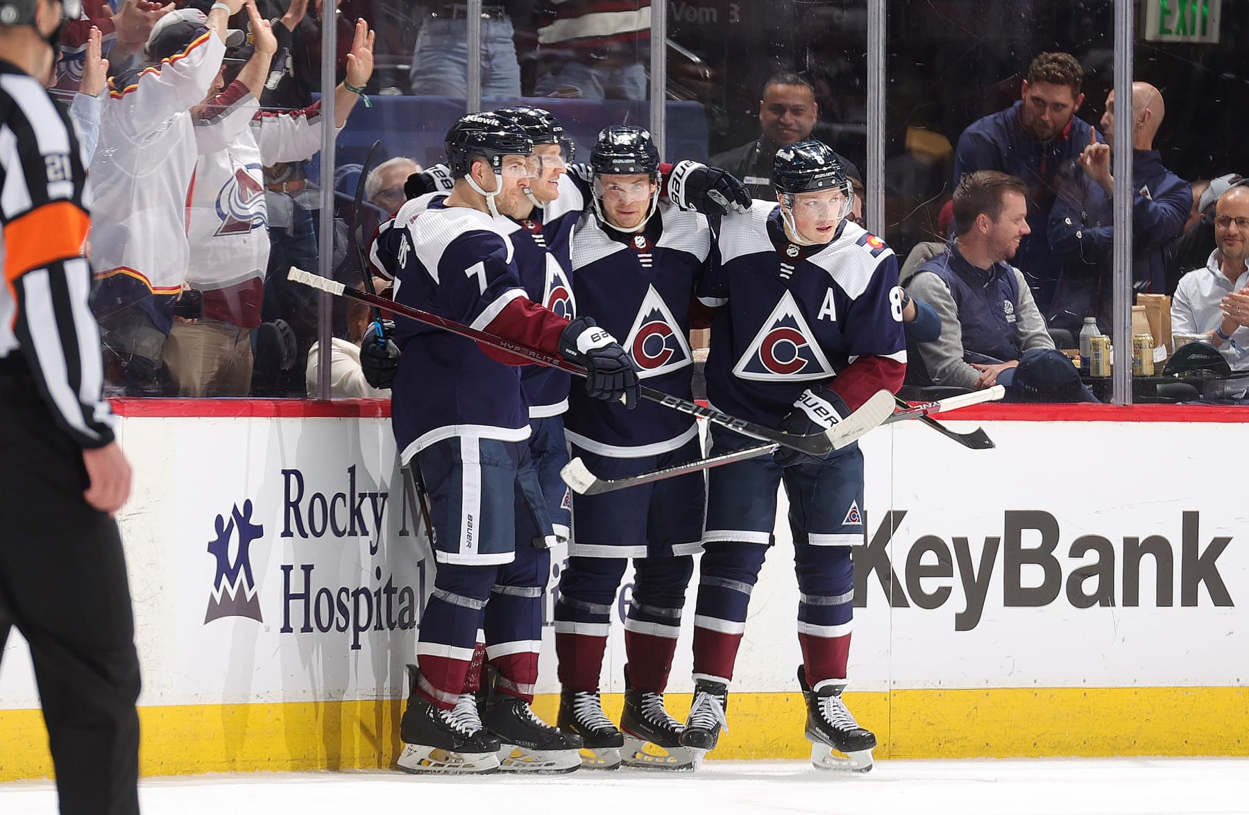 DENVER, COLORADO - APRIL 09: Devon Toews #7, Nathan MacKinnon #29, Artturi Lehkonen #62 and Cale Makar #8 of the Colorado Avalanche celebrate after MacKinnon's 50th goal of the season against the Minnesota Wild at Ball Arena on April 9, 2024 in Denver, Colorado. (Photo by Michael Martin/NHLI via Getty Images)