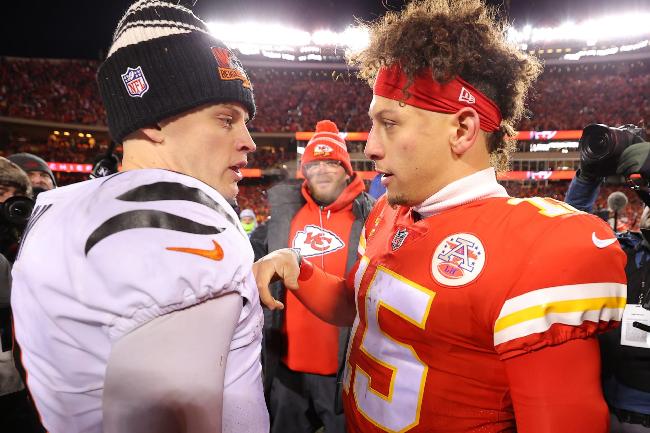 KANSAS CITY, MISSOURI - JANUARY 29: Joe Burrow #9 of the Cincinnati Bengals and Patrick Mahomes #15 of the Kansas City Chiefs meet on the field after the AFC Championship Game at GEHA Field at Arrowhead Stadium on January 29, 2023 in Kansas City, Missouri. (Photo by Kevin C. Cox/Getty Images) KANSAS CITY, MISSOURI - JANUARY 29: Joe Burrow #9 of the Cincinnati Bengals and Patrick Mahomes #15 of the Kansas City Chiefs meet on the field after the AFC Championship Game at GEHA Field at Arrowhead Stadium on January 29, 2023 in Kansas City, Missouri. (Photo by Kevin C. Cox/Getty Images)