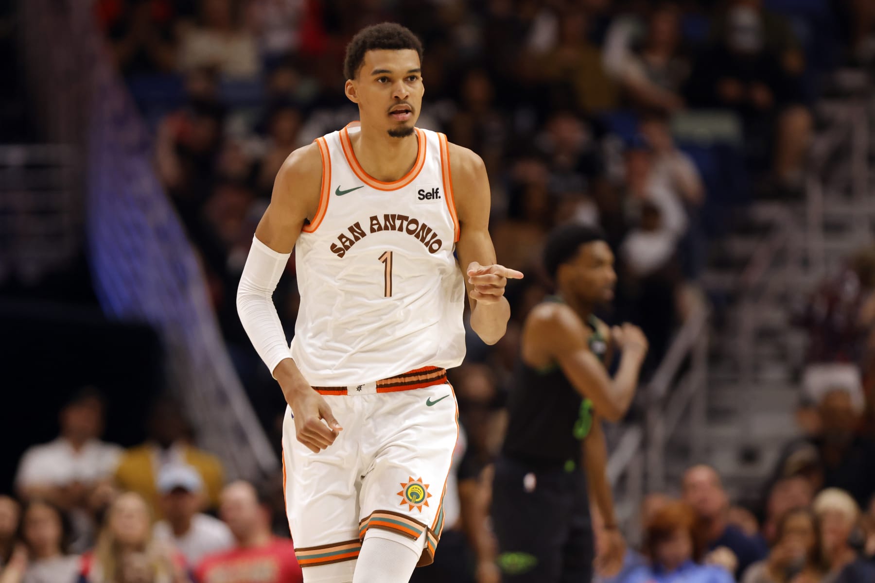 NEW ORLEANS, LOUISIANA - APRIL 05: Victor Wembanyama #1 of the San Antonio Spurs walks backcourt during a game against the New Orleans Pelicans at Smoothie King Center on April 05, 2024 in New Orleans, Louisiana.  NOTE TO USER: User expressly acknowledges and agrees that, by downloading and or using this photograph, User is consenting to the terms and conditions of the Getty Images License Agreement. (Photo by Tyler Kaufman/Getty Images)