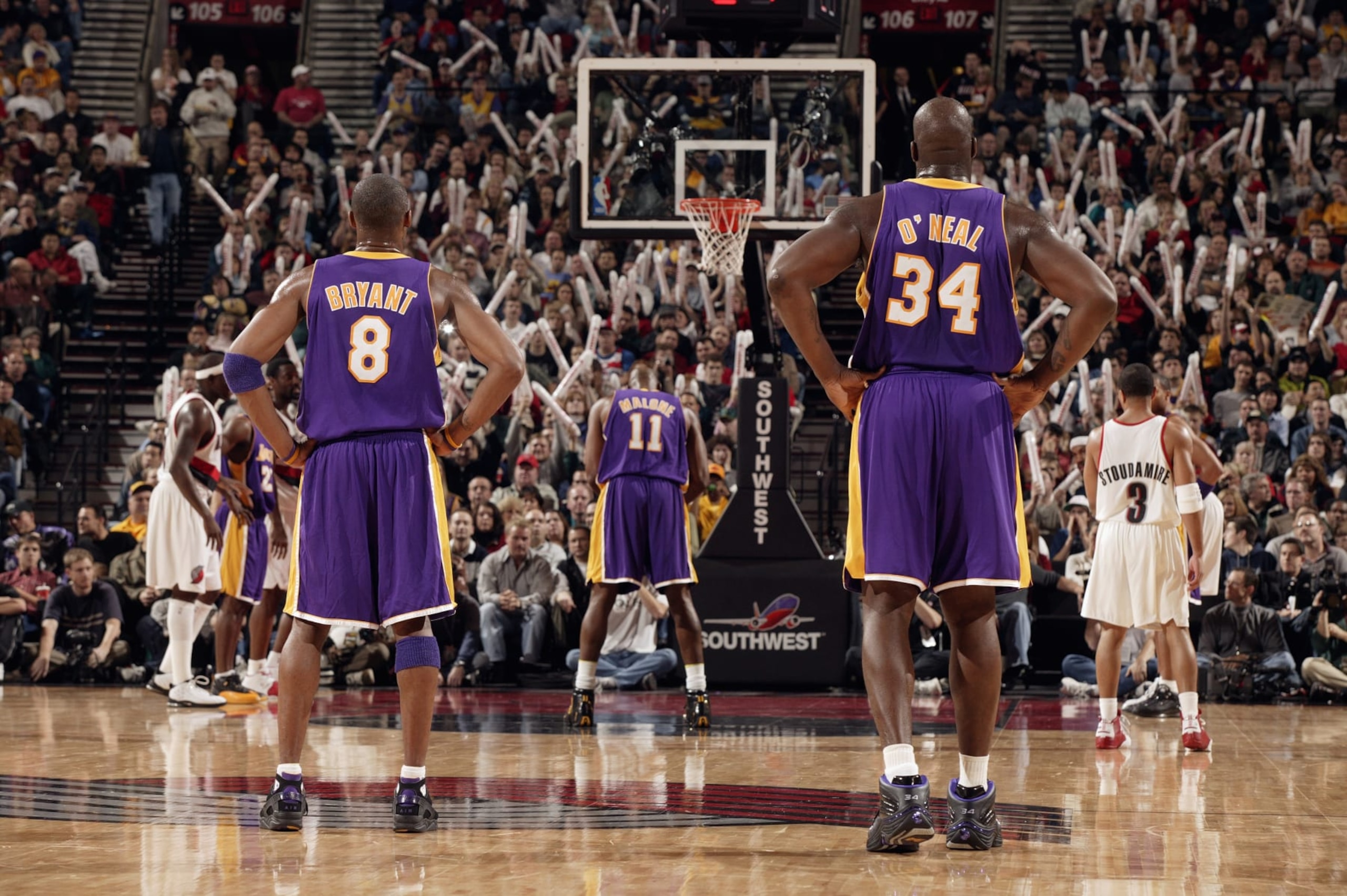 PORTLAND, OR - DECEMBER 13: Karl Malone #11 of the Los Angeles Lakers shoots a free throw as teammates Kobe Bryant #8 and Shaquille O'Neal #34 look on during the game against the Portland Trail Blazers on December 13, 2003 at the Rose Garden in Portland, Oregon. The Trail Blazers won 112-108. NOTE TO USER: User expressly acknowledges and agrees that, by downloading and/or using this Photograph, User is consenting to the terms and conditions of the Getty Images License Agreement. (Photo by Sam Forencich/NBAE via Getty Images) PORTLAND, OR - DECEMBER 13: Karl Malone #11 of the Los Angeles Lakers shoots a free throw as teammates Kobe Bryant #8 and Shaquille O'Neal #34 look on during the game against the Portland Trail Blazers on December 13, 2003 at the Rose Garden in Portland, Oregon. The Trail Blazers won 112-108. NOTE TO USER: User expressly acknowledges and agrees that, by downloading and/or using this Photograph, User is consenting to the terms and conditions of the Getty Images License Agreement. (Photo by Sam Forencich/NBAE via Getty Images)
