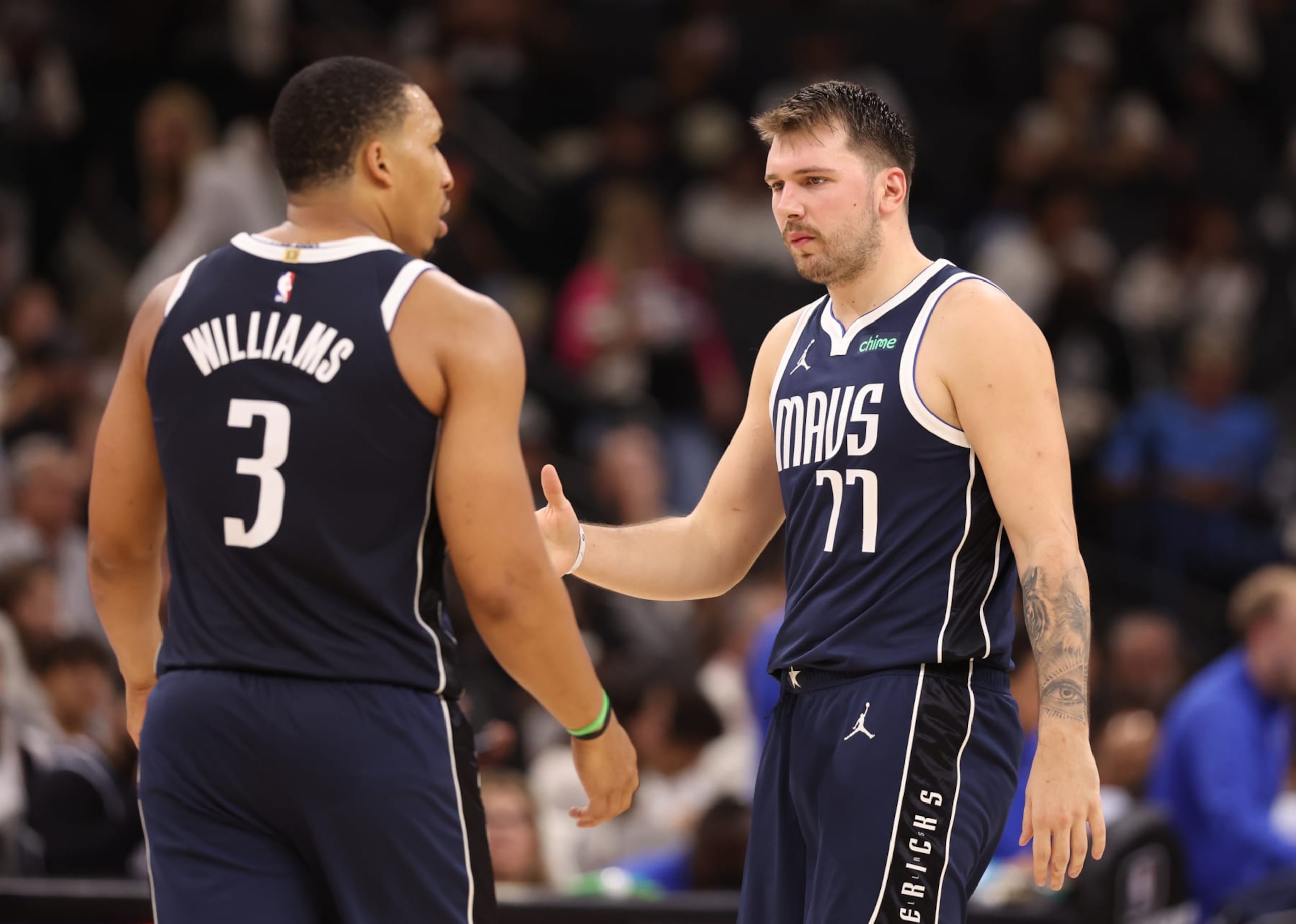 SAN ANTONIO, TEXAS - OCTOBER 25: Luka Doncic #77 and Grant Williams #3 of the Dallas Mavericks react during the third quarter against the San Antonio Spurs at Frost Bank Center on October 25, 2023 in San Antonio, Texas. NOTE TO USER: User expressly acknowledges and agrees that, by downloading and/or using this Photograph, user is consenting to the terms and conditions of the Getty Images License Agreement. (Photo by Christian Petersen/Getty Images)
