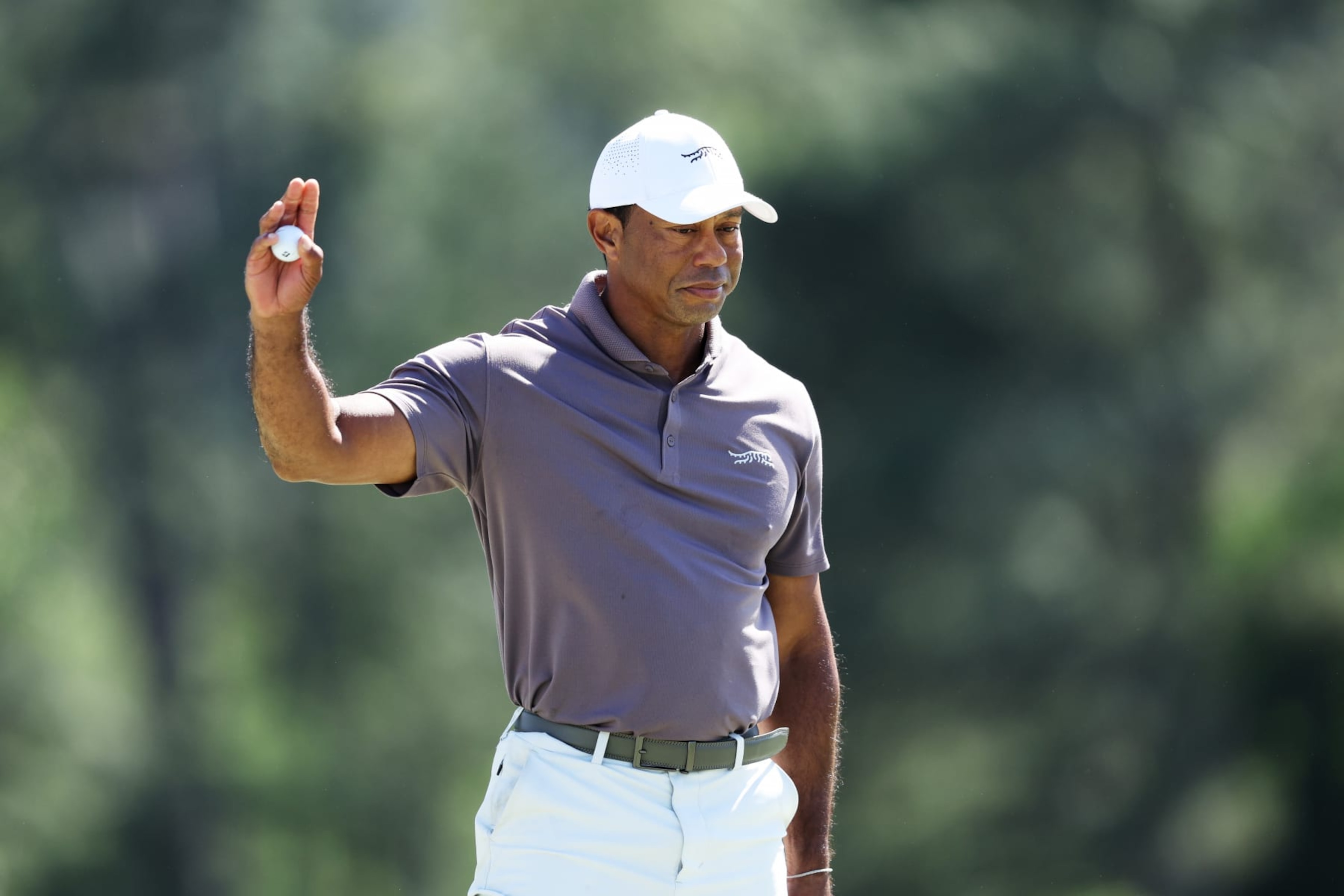 AUGUSTA, GEORGIA - APRIL 12: Tiger Woods of the United States reacts on the 18th green during the second round of the 2024 Masters Tournament at Augusta National Golf Club on April 12, 2024 in Augusta, Georgia. (Photo by Warren Little/Getty Images) AUGUSTA, GEORGIA - APRIL 12: Tiger Woods of the United States reacts on the 18th green during the second round of the 2024 Masters Tournament at Augusta National Golf Club on April 12, 2024 in Augusta, Georgia. (Photo by Warren Little/Getty Images)