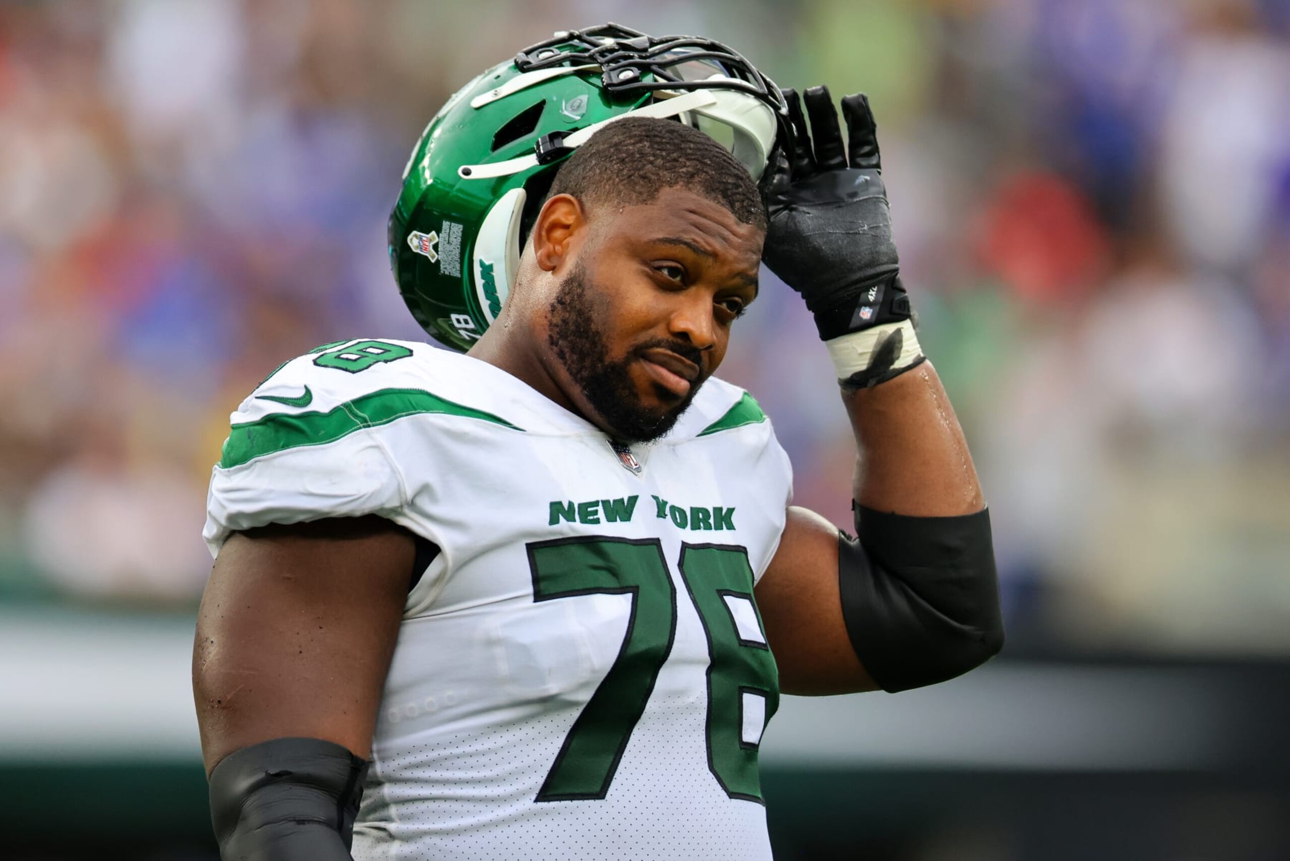 EAST RUTHERFORD, NEW JERSEY - NOVEMBER 06: Laken Tomlinson #78 of the New York Jets looks while a Skycam is repaired in the second half of a game against the Buffalo Bills at MetLife Stadium on November 06, 2022 in East Rutherford, New Jersey. (Photo by Mike Stobe/Getty Images) EAST RUTHERFORD, NEW JERSEY - NOVEMBER 06: Laken Tomlinson #78 of the New York Jets looks while a Skycam is repaired in the second half of a game against the Buffalo Bills at MetLife Stadium on November 06, 2022 in East Rutherford, New Jersey. (Photo by Mike Stobe/Getty Images)
