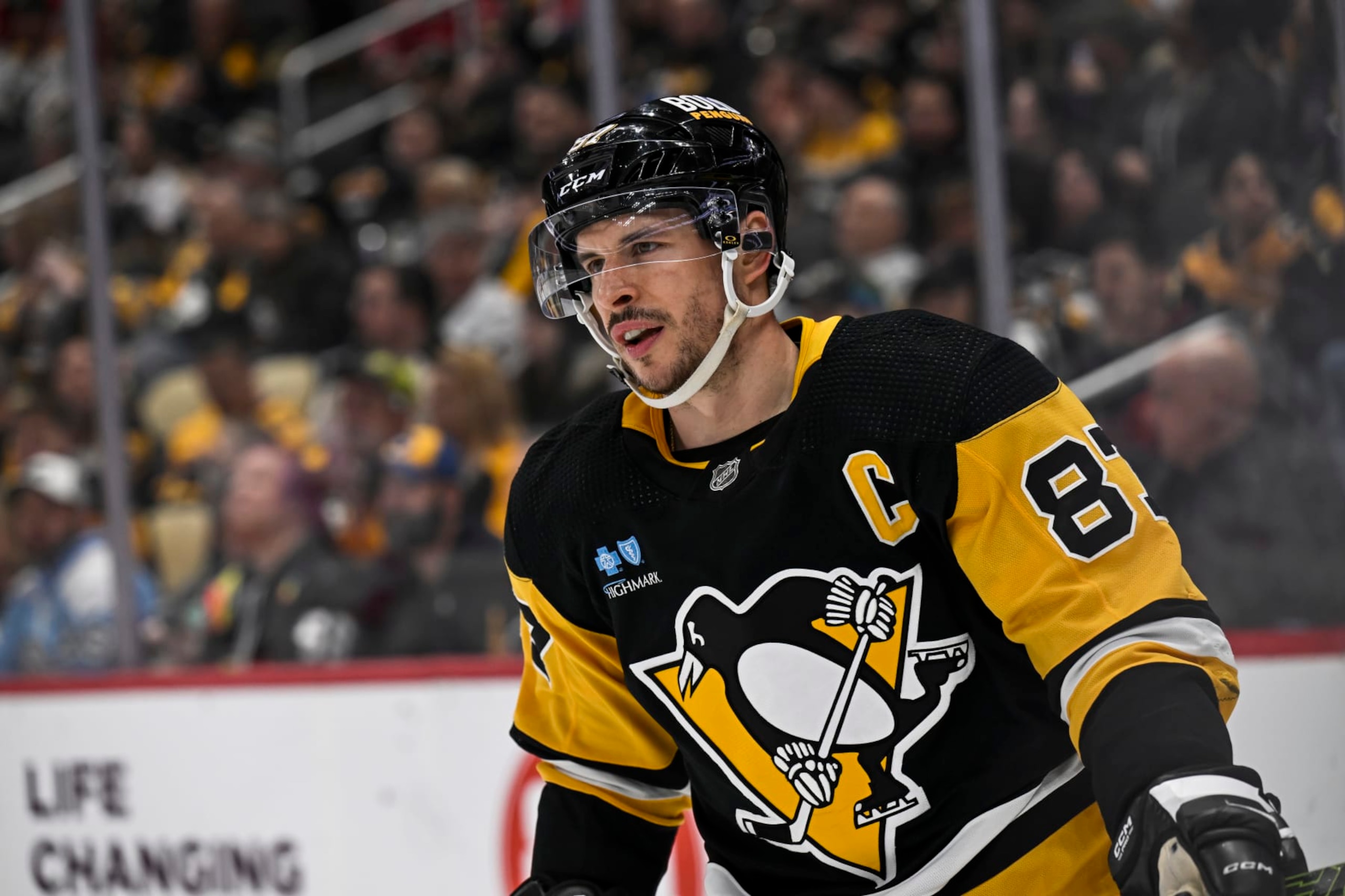 PITTSBURGH, PA - MARCH 26: Pittsburgh Penguins center Sidney Crosby (87) looks on during the second period in the NHL game between the Pittsburgh Penguins and the Carolina Hurricanes on March 26, 2024, at PPG Paints Arena in Pittsburgh, PA. (Photo by Jeanine Leech/Icon Sportswire via Getty Images)