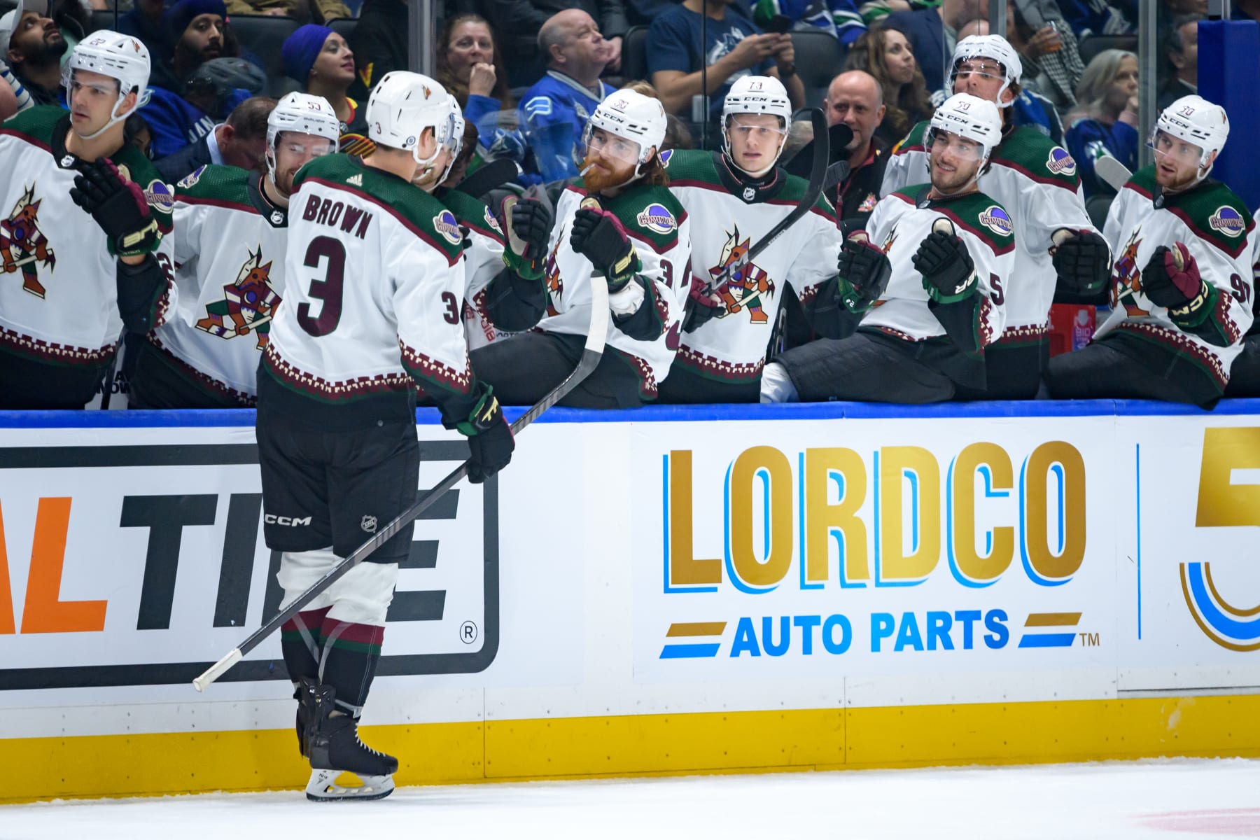 VANCOUVER, CANADA - APRIL 10: Josh Brown #3 of the Arizona Coyotes is congratulated at the bench after scoring a goal against the Vancouver Canucks during the second period of their NHL game at Rogers Arena on April 10, 2024 in Vancouver, British Columbia, Canada. (Photo by Derek Cain/Getty Images)