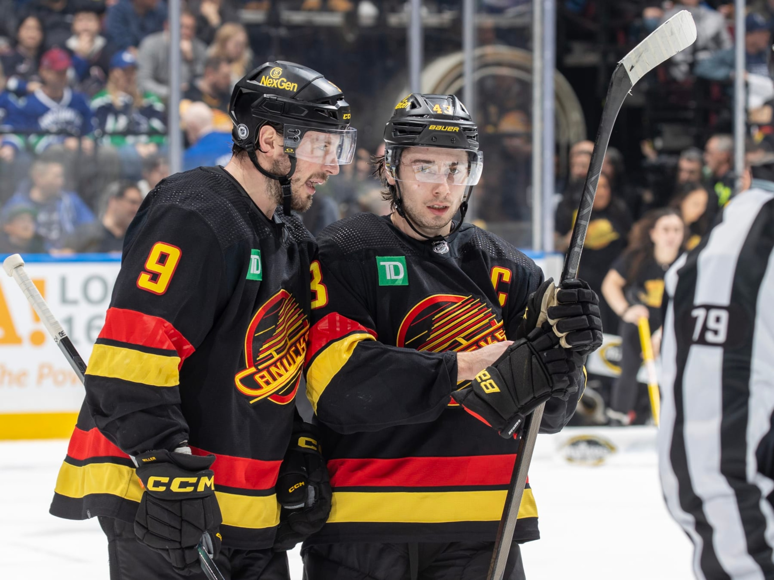 J.T. Miller and Quinn Hughes
