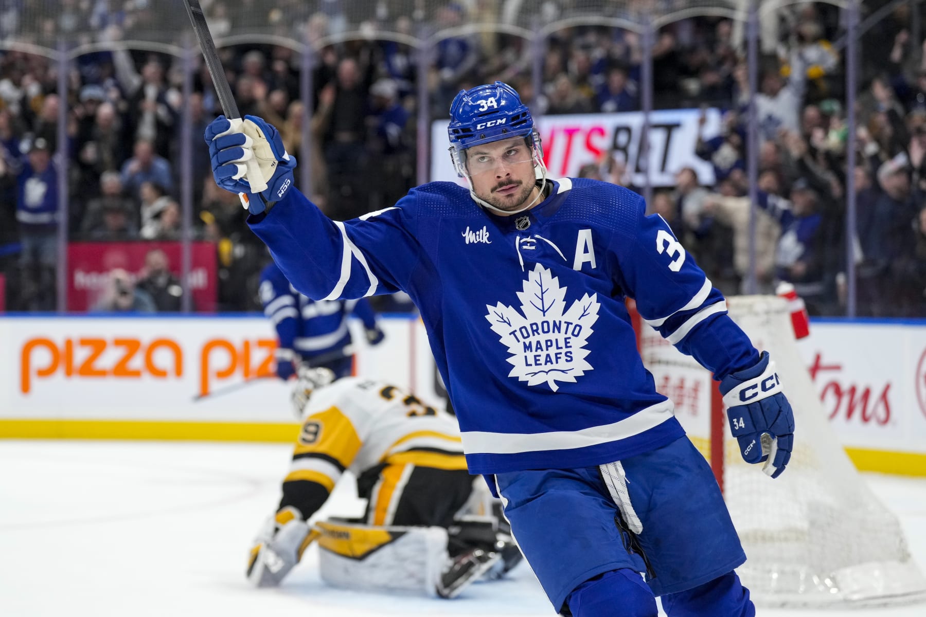 TORONTO, ON - APRIL 8: Auston Matthews #34 of the Toronto Maple Leafs celebrates after defeating the Pittsburgh Penguins during the overtime period at Scotiabank Arena on April 8, 2024 in Toronto, Ontario, Canada. (Photo by Kevin Sousa/NHLI via Getty Images)