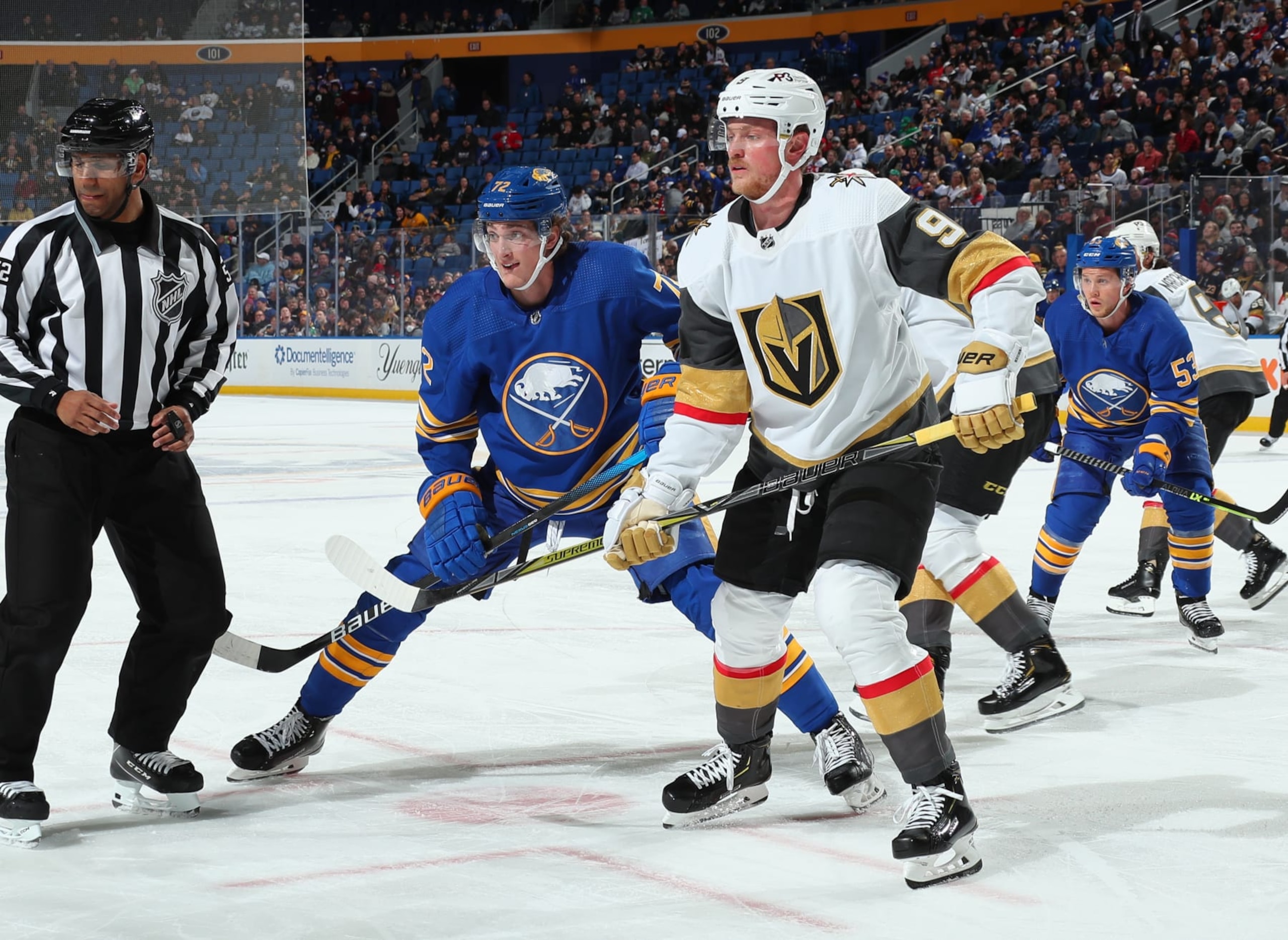 BUFFALO, NY - MARCH 10: Tage Thompson #72 of the Buffalo Sabres, playing in his 200th NHL game, battles for position against Jack Eichel #9 of the Vegas Golden Knights on March 10, 2022 at KeyBank Center in Buffalo, New York. (Photo by Bill Wippert/NHLI via Getty Images)