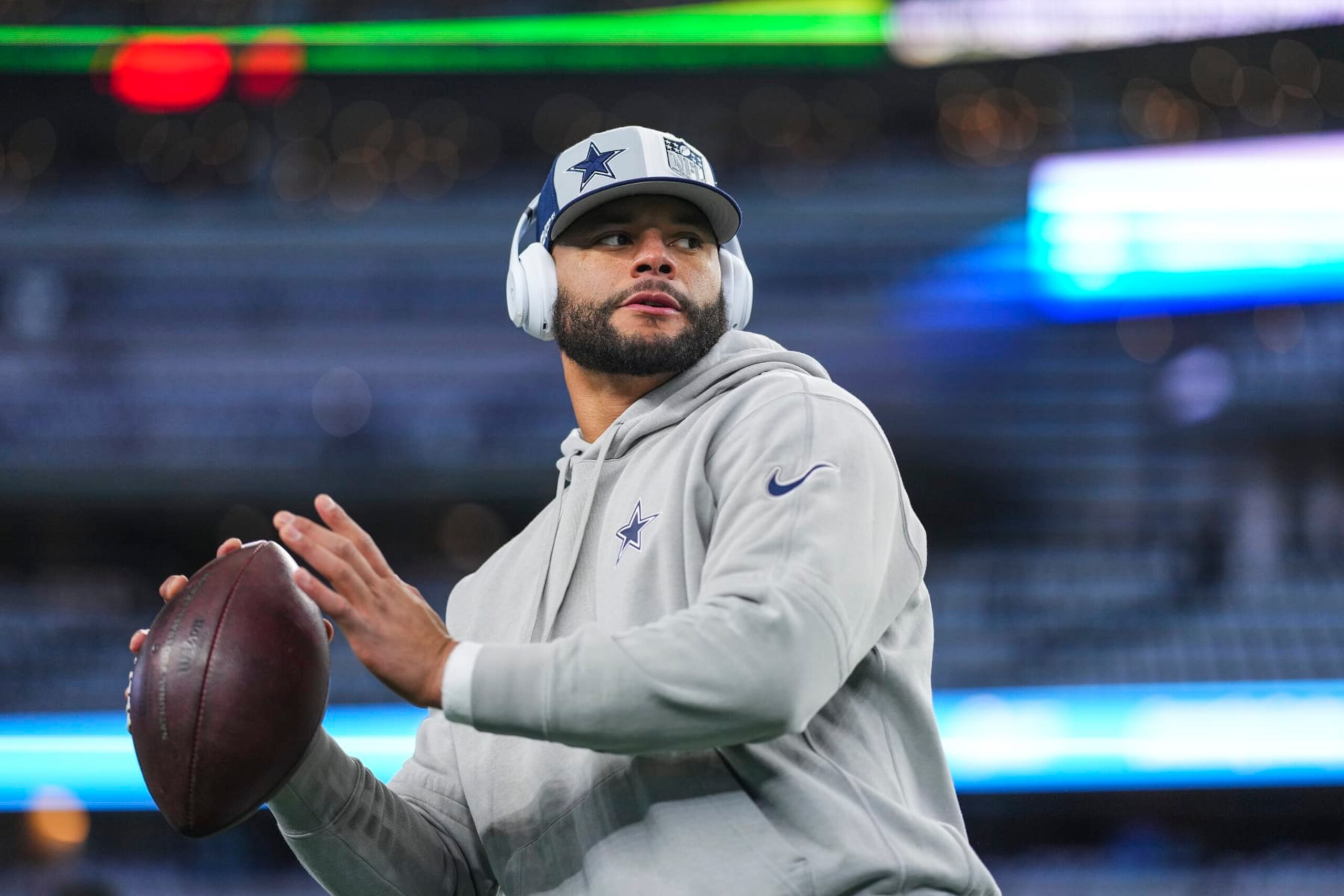 DALLAS, TX - JANUARY 14: Dak Prescott #4 of the Dallas Cowboys warms up prior to an NFL wild-card playoff football game against the Green Bay Packers at AT&T Stadium on January 14, 2024 in Dallas, Texas. (Photo by Cooper Neill/Getty Images)