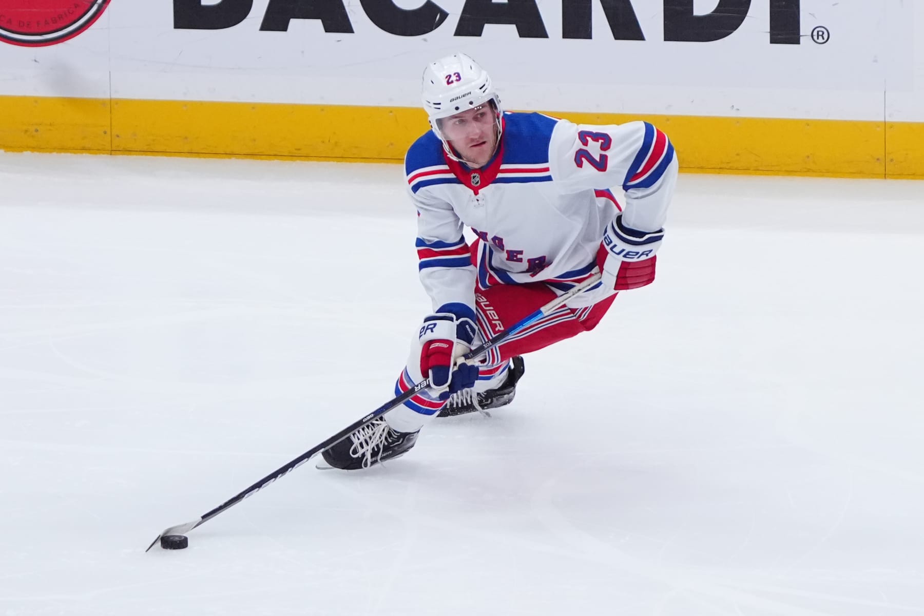 ELMONT, NY - APRIL 09: New York Rangers Defenceman Adam Fox (23) skates with the puck during the first period of the National Hockey League game between the New York Rangers and the New York Islanders on April 9, 2024, at UBS Arena in Elmont, NY. (Photo by Gregory Fisher/Icon Sportswire via Getty Images)