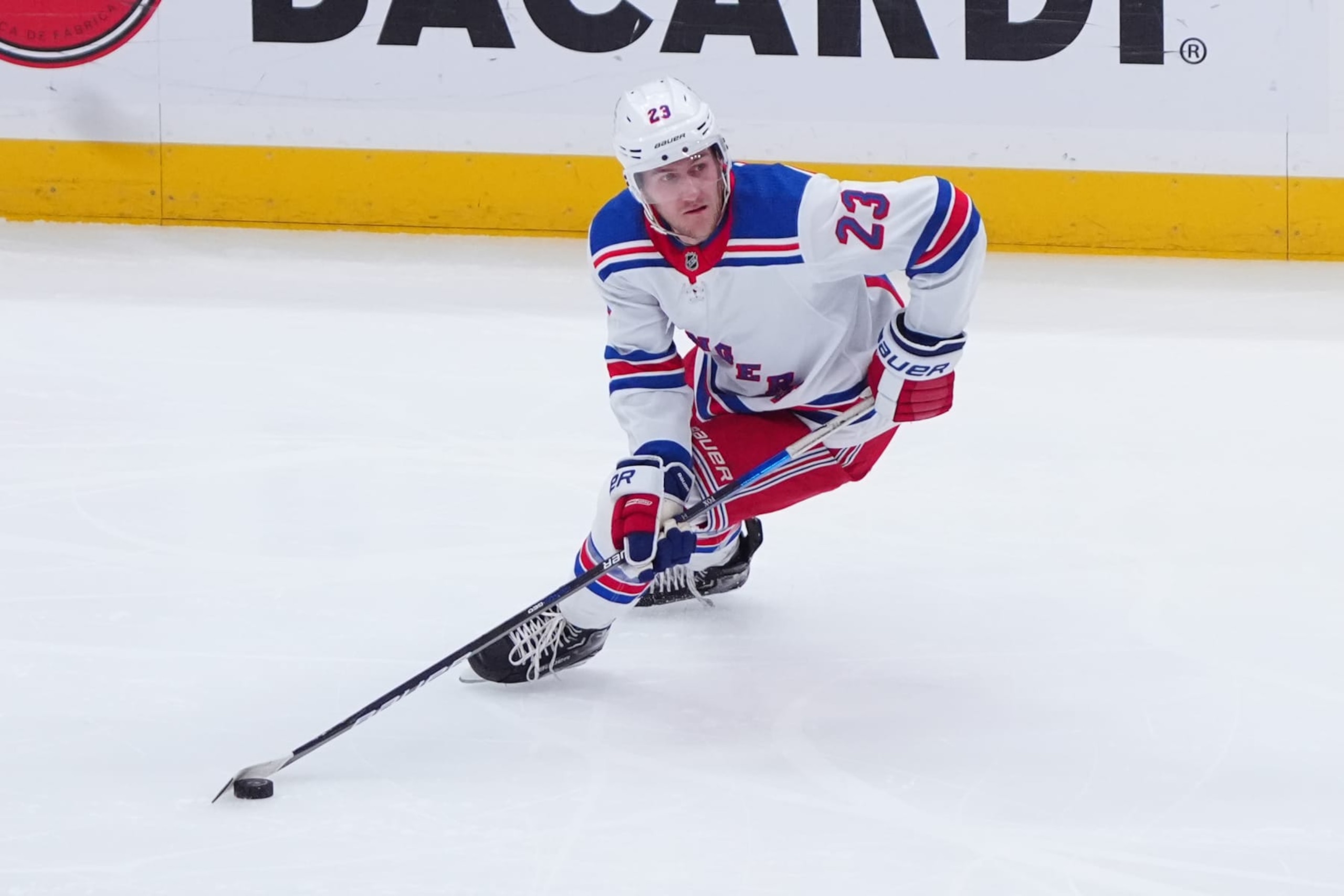 ELMONT, NY - APRIL 09: New York Rangers Defenceman Adam Fox (23) skates with the puck during the first period of the National Hockey League game between the New York Rangers and the New York Islanders on April 9, 2024, at UBS Arena in Elmont, NY. (Photo by Gregory Fisher/Icon Sportswire via Getty Images)