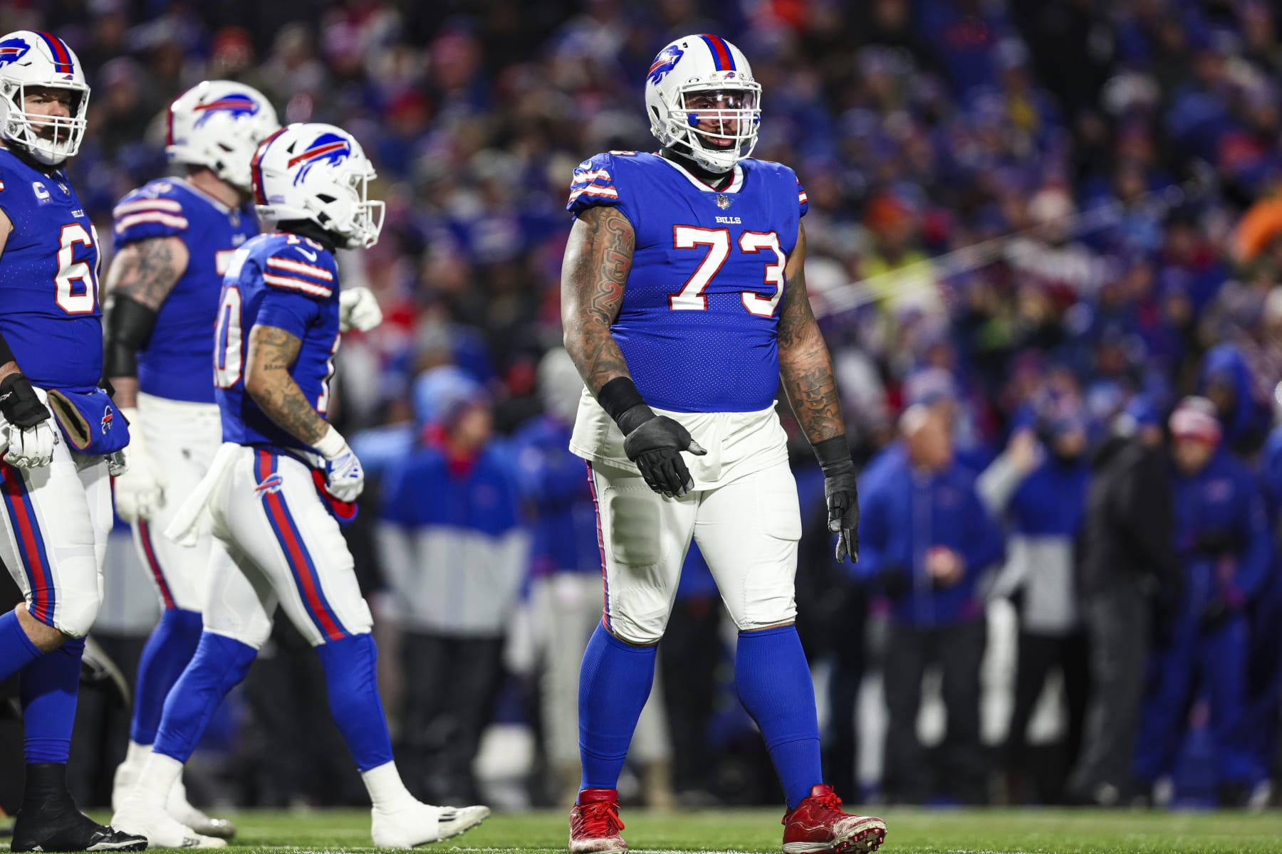 ORCHARD PARK, NY - JANUARY 21: Dion Dawkins #73 of the Buffalo Bills looks on from the field during an NFL divisional round playoff football game against the Kansas City Chiefs at Highmark Stadium on January 21, 2024 in Orchard Park, New York. (Photo by Perry Knotts/Getty Images)