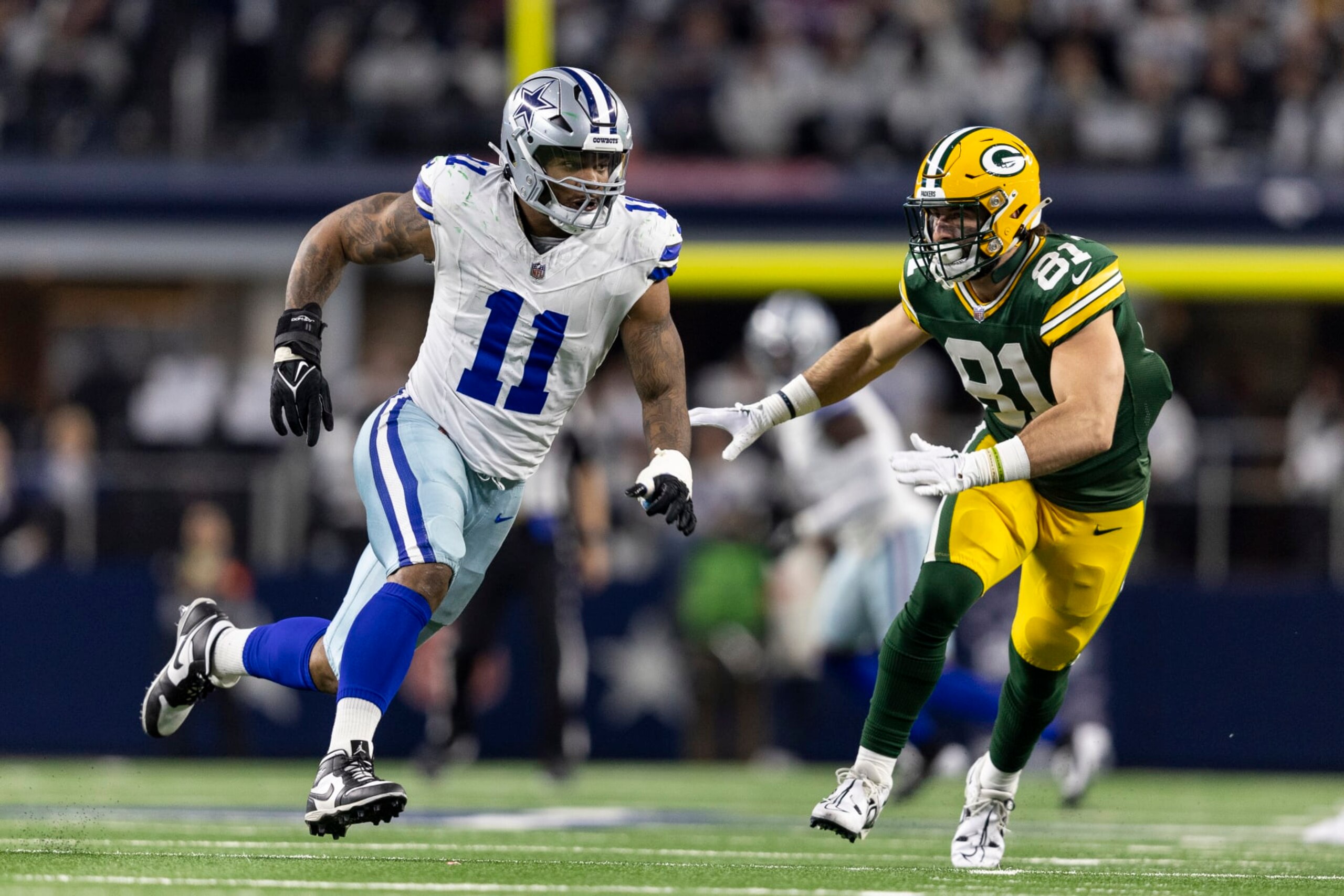 ARLINGTON, TEXAS - JANUARY 14: Micah Parsons #11 of the Dallas Cowboys runs around the edge during an NFL wild-card playoff football game between the Dallas Cowboys and the Green Bay Packers at AT&T Stadium on January 14, 2024 in Arlington, Texas. (Photo by Michael Owens/Getty Images) ARLINGTON, TEXAS - JANUARY 14: Micah Parsons #11 of the Dallas Cowboys runs around the edge during an NFL wild-card playoff football game between the Dallas Cowboys and the Green Bay Packers at AT&T Stadium on January 14, 2024 in Arlington, Texas. (Photo by Michael Owens/Getty Images)