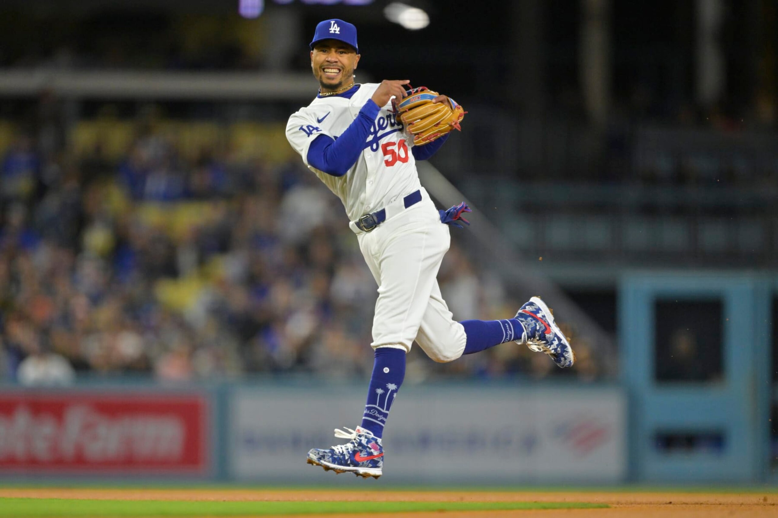 LOS ANGELES, CALIFORNIA - APRIL 12: Fernando Tatis Jr. #23 of the San Diego Padres is out at second as Mookie Betts #50 of the Los Angeles Dodgers throws to first to complete a double play in the third inning at Dodger Stadium on April 12, 2024 in Los Angeles, California. (Photo by Jayne Kamin-Oncea/Getty Images) LOS ANGELES, CALIFORNIA - APRIL 12: Fernando Tatis Jr. #23 of the San Diego Padres is out at second as Mookie Betts #50 of the Los Angeles Dodgers throws to first to complete a double play in the third inning at Dodger Stadium on April 12, 2024 in Los Angeles, California. (Photo by Jayne Kamin-Oncea/Getty Images)