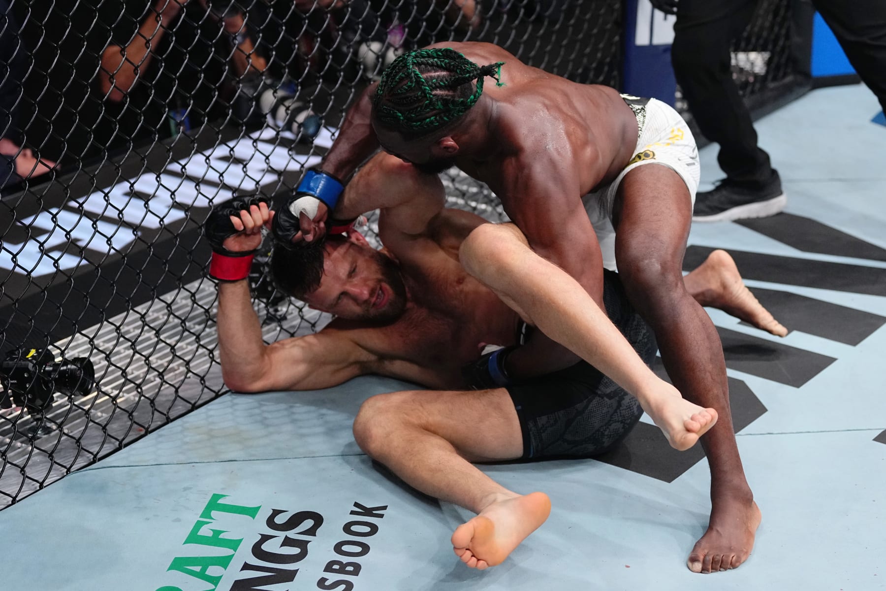 LAS VEGAS, NEVADA - APRIL 13: (R-L) Aljamain Sterling punches Calvin Kattar in a featherweight fight during the UFC 300 event at T-Mobile Arena on April 13, 2024 in Las Vegas, Nevada.  (Photo by Jeff Bottari/Zuffa LLC via Getty Images)