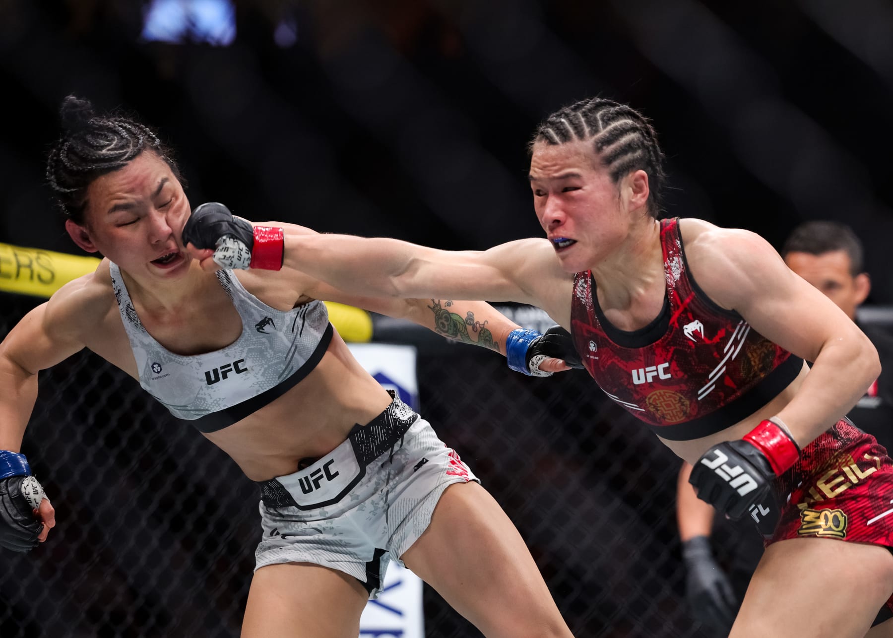 LAS VEGAS, NEVADA - APRIL 13: Zhang Weili of China punches Yan Xiaonan of China during their strawweight championship tight fight at T-Mobile Arena on April 13, 2024 in Las Vegas, Nevada. (Photo by Carmen Mandato/Getty Images)
