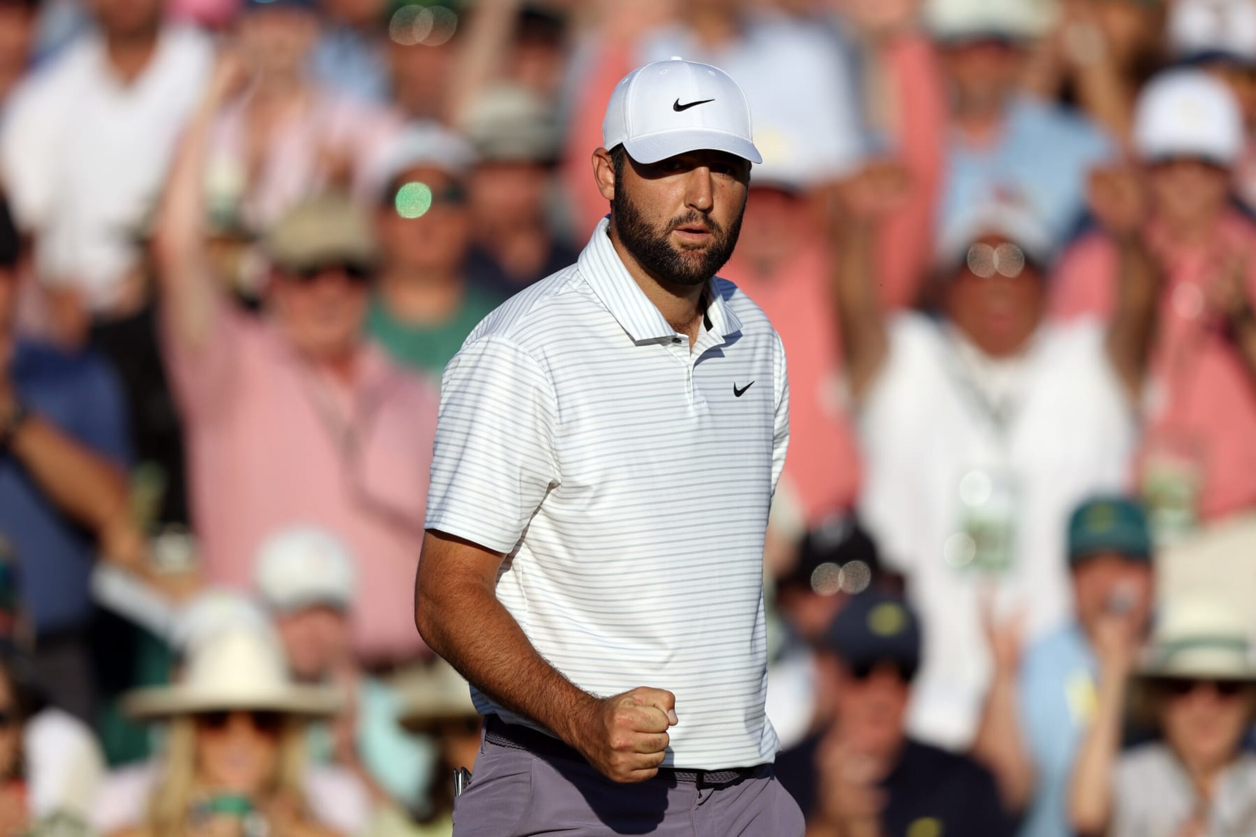 AUGUSTA, GEORGIA - APRIL 13: Scottie Scheffler of the United States reacts after making birdie on the 18th green during the third round of the 2024 Masters Tournament at Augusta National Golf Club on April 13, 2024 in Augusta, Georgia. (Photo by Warren Little/Getty Images) AUGUSTA, GEORGIA - APRIL 13: Scottie Scheffler of the United States reacts after making birdie on the 18th green during the third round of the 2024 Masters Tournament at Augusta National Golf Club on April 13, 2024 in Augusta, Georgia. (Photo by Warren Little/Getty Images)