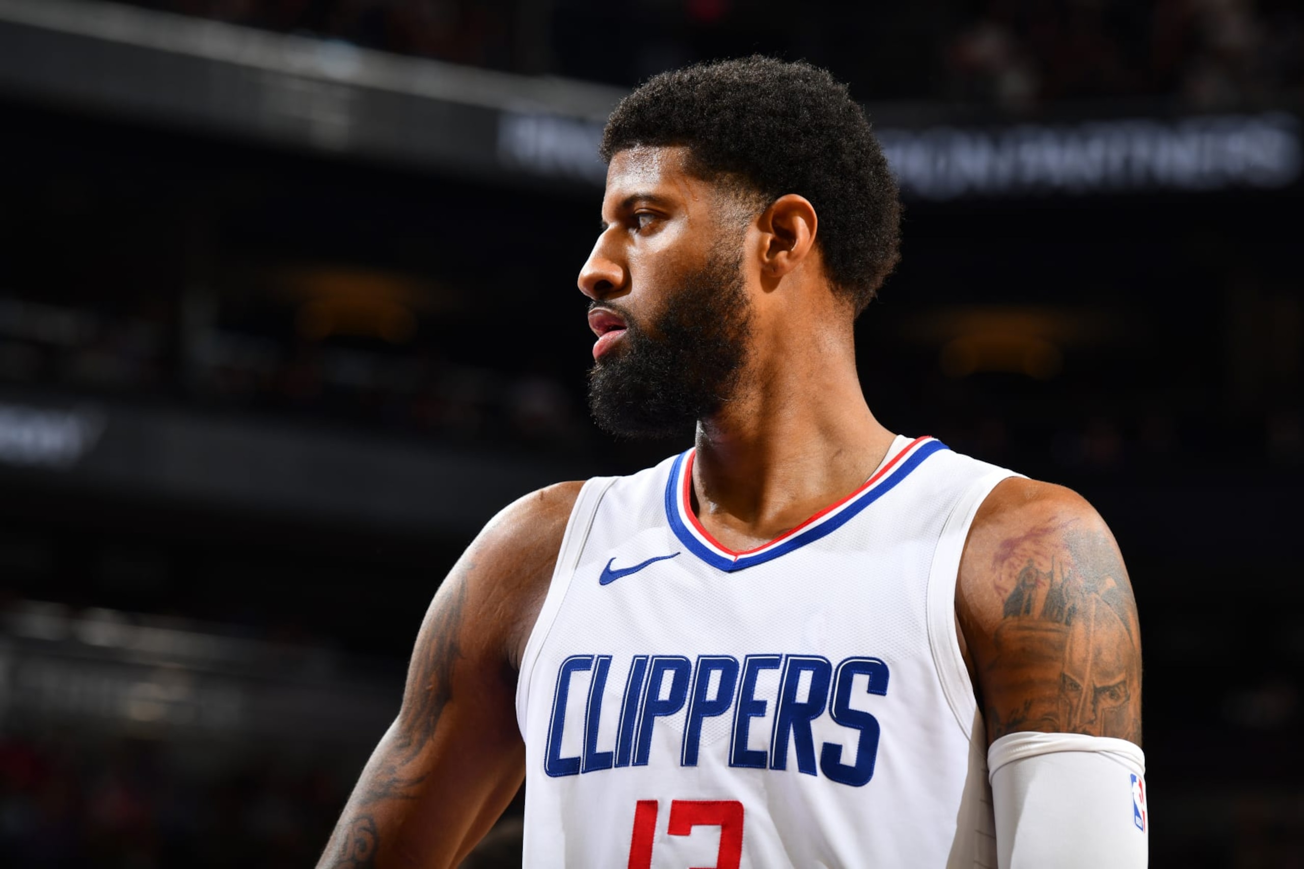 PHOENIX, AZ - APRIL 9:  Paul George #13 of the LA Clippers looks on during the game on April 9, 2024 at Footprint Center in Phoenix, Arizona. NOTE TO USER: User expressly acknowledges and agrees that, by downloading and or using this photograph, user is consenting to the terms and conditions of the Getty Images License Agreement. Mandatory Copyright Notice: Copyright 2024 NBAE (Photo by Barry Gossage/NBAE via Getty Images)