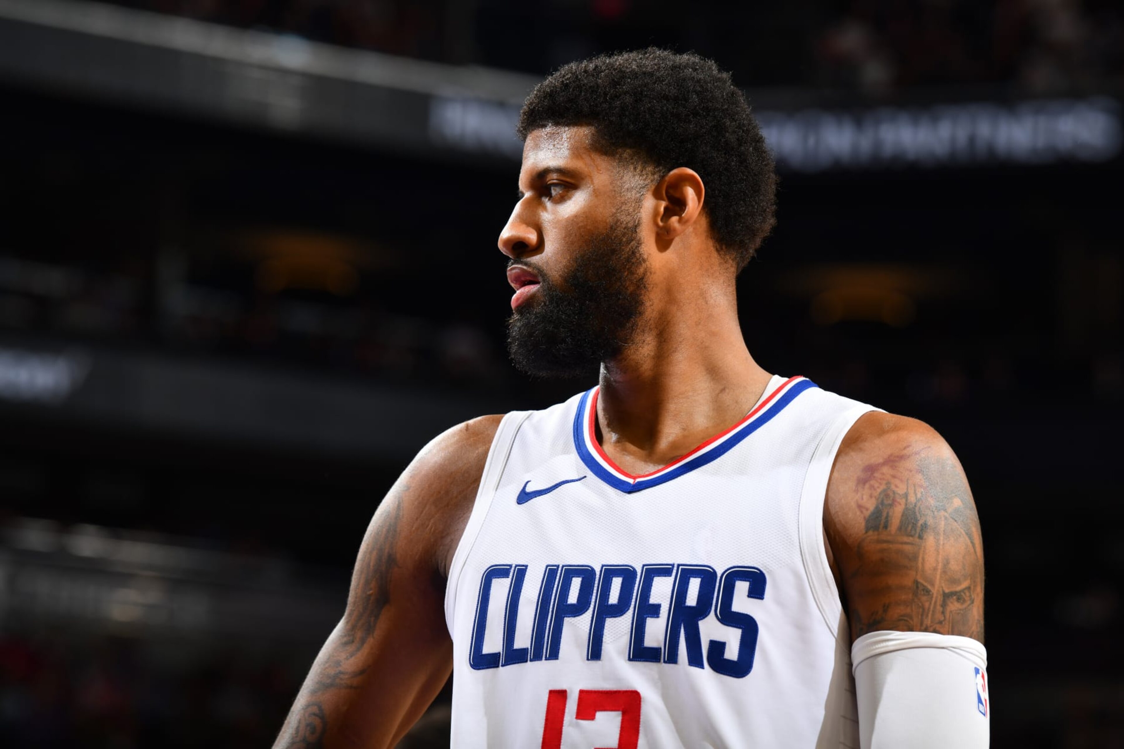 PHOENIX, AZ - APRIL 9:  Paul George #13 of the LA Clippers looks on during the game on April 9, 2024 at Footprint Center in Phoenix, Arizona. NOTE TO USER: User expressly acknowledges and agrees that, by downloading and or using this photograph, user is consenting to the terms and conditions of the Getty Images License Agreement. Mandatory Copyright Notice: Copyright 2024 NBAE (Photo by Barry Gossage/NBAE via Getty Images)