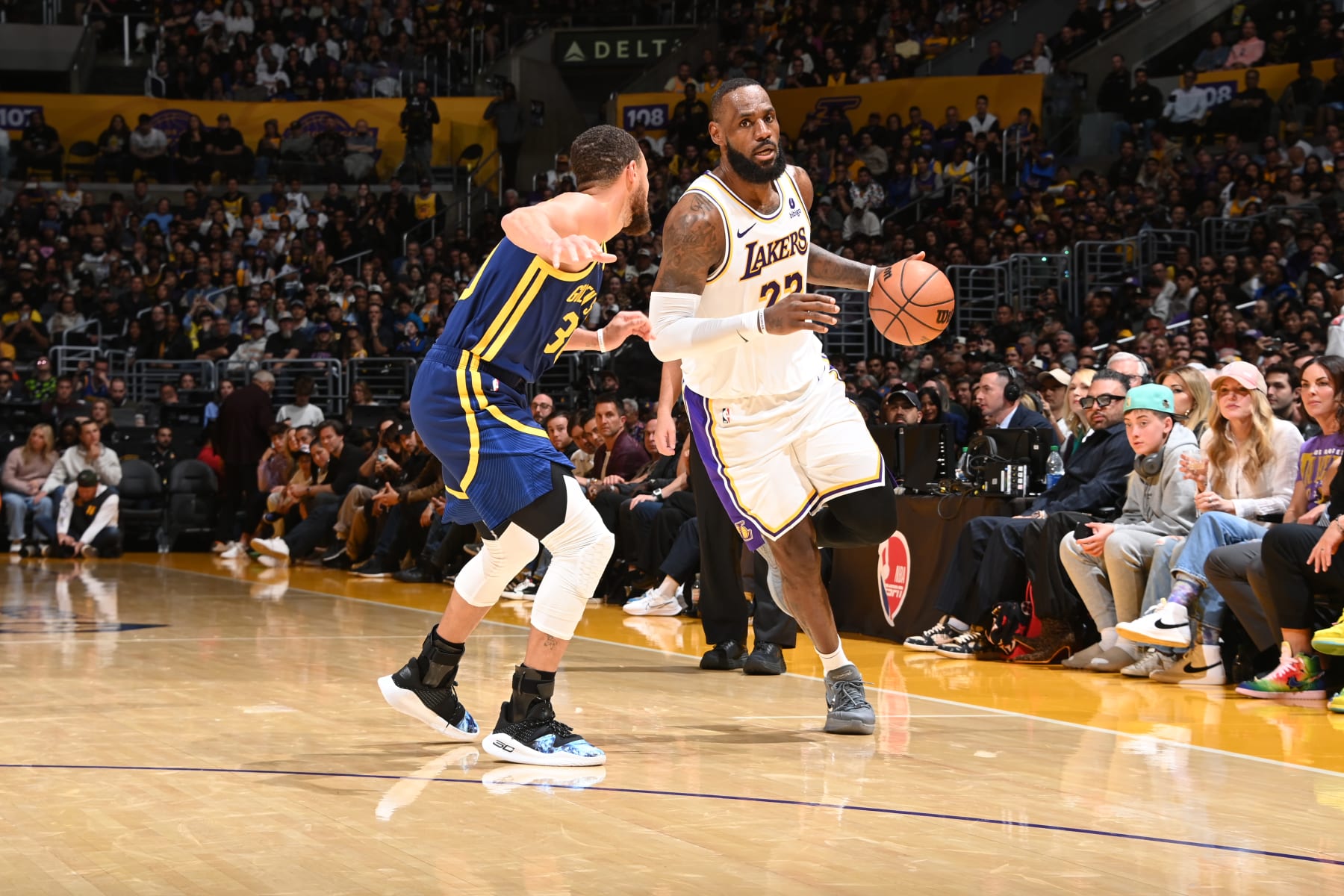 LOS ANGELES, CA - MARCH 16:  Stephen Curry #30 of the Golden State Warriors plays defense during the game  against LeBron James #23 of the Los Angeles Lakers on March 16, 2024 at Crypto.Com Arena in Los Angeles, California. NOTE TO USER: User expressly acknowledges and agrees that, by downloading and/or using this Photograph, user is consenting to the terms and conditions of the Getty Images License Agreement. Mandatory Copyright Notice: Copyright 2024 NBAE (Photo by Andrew D. Bernstein/NBAE via Getty Images)