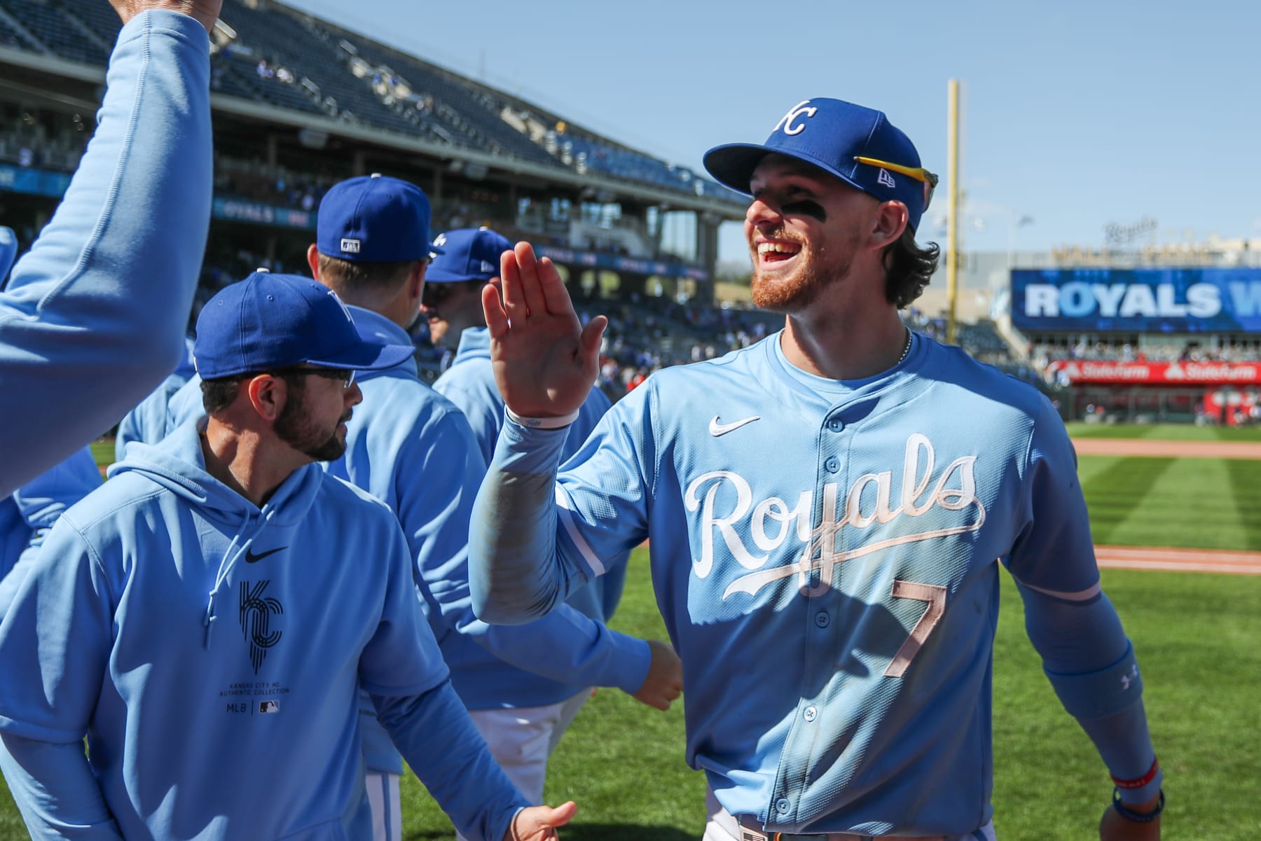 KANSAS CITY, MO - APRIL 11: Kansas City Royals shortstop Bobby Witt Jr. (7) gets high fives from teammates after an MLB game between the Houston Astros and Kansas City Royals on Apr 11, 2024 at Kauffman Stadium in Kansas City, MO. (Photo by Scott Winters/Icon Sportswire via Getty Images)