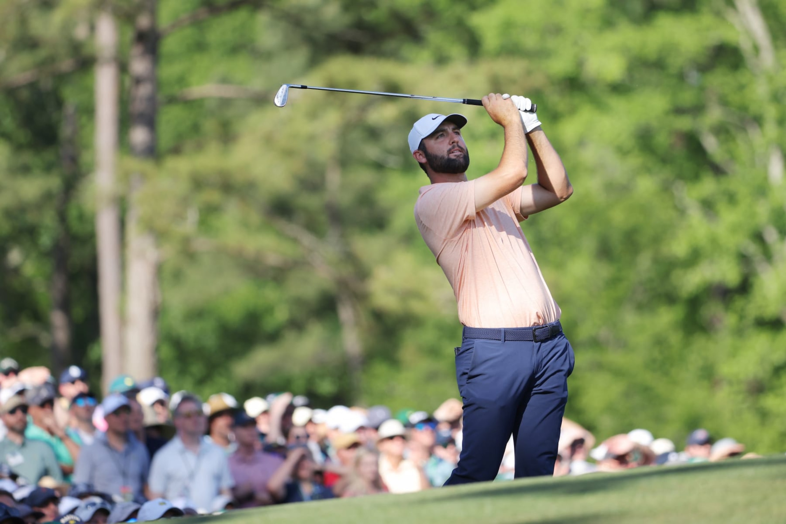 AUGUSTA, GEORGIA - APRIL 14: Scottie Scheffler of the United States plays his shot from the 12th tee during the final round of the 2024 Masters Tournament at Augusta National Golf Club on April 14, 2024 in Augusta, Georgia. (Photo by Jamie Squire/Getty Images) AUGUSTA, GEORGIA - APRIL 14: Scottie Scheffler of the United States plays his shot from the 12th tee during the final round of the 2024 Masters Tournament at Augusta National Golf Club on April 14, 2024 in Augusta, Georgia. (Photo by Jamie Squire/Getty Images)