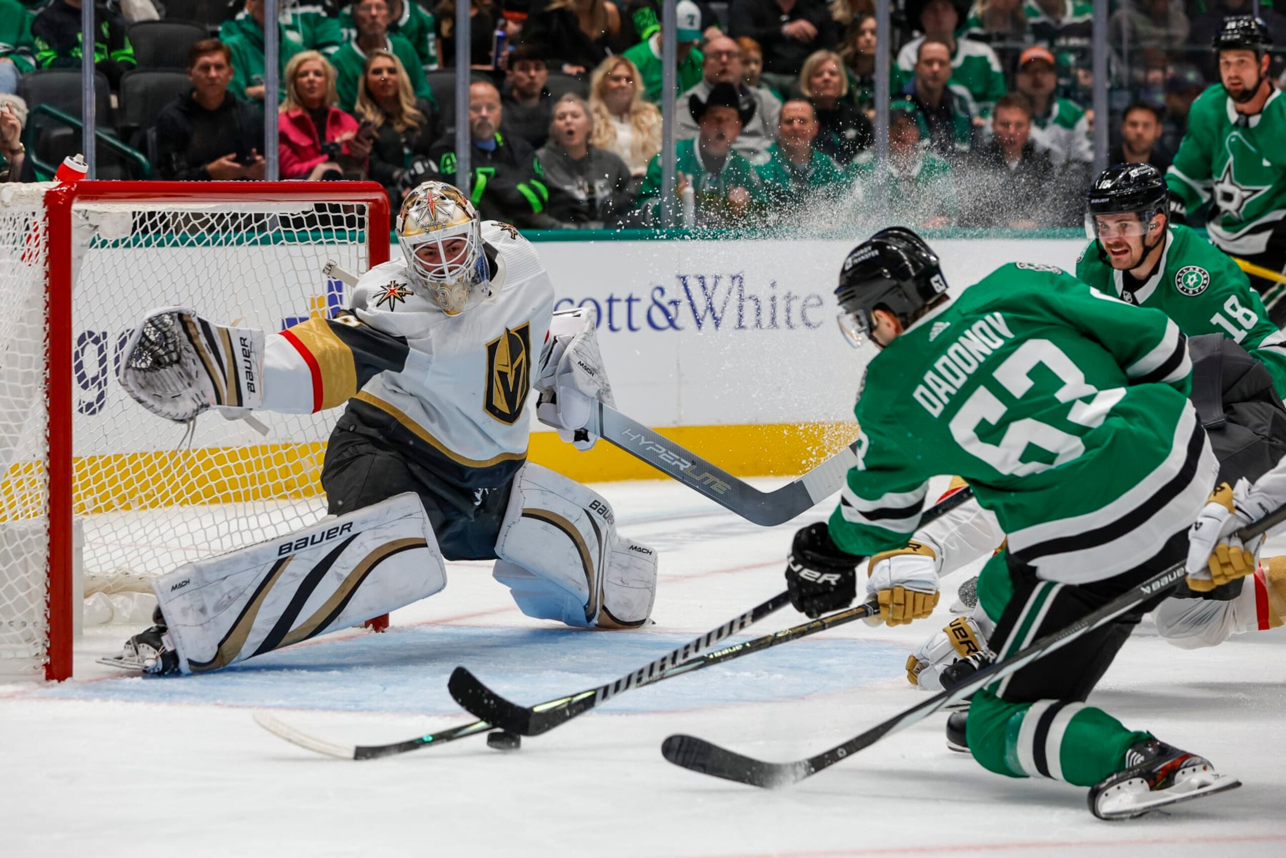 DALLAS, TX - DECEMBER 09: Dallas Stars right wing Evgenii Dadonov (63) shoots and scores a goal against Vegas Golden Knights goaltender Logan Thompson (36) during the game between the Dallas Stars and the Vegas Golden Knights on December 9, 2023 at American Airlines Center in Dallas, Texas. (Photo by Matthew Pearce/Icon Sportswire via Getty Images)