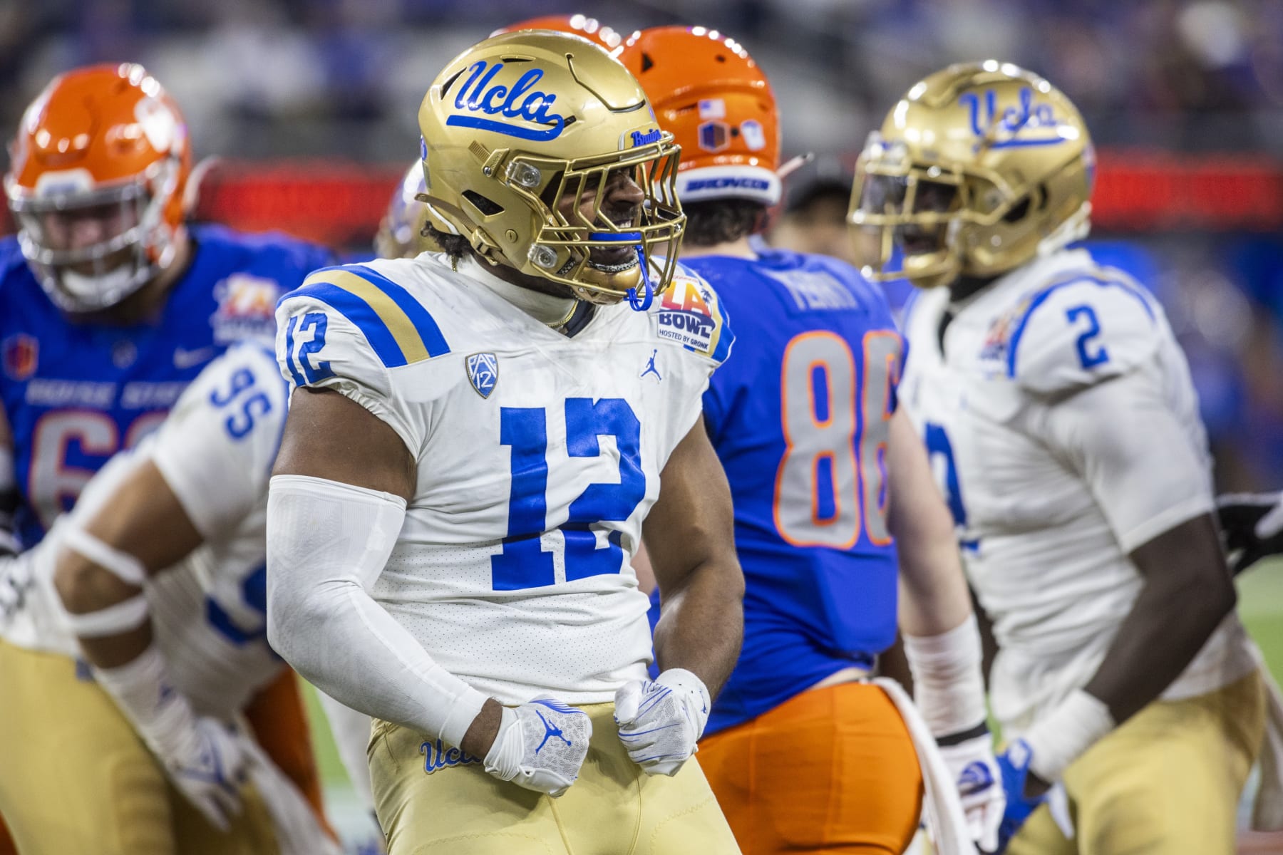 INGLEWOOD, CA - DECEMBER 16: UCLA defensive lineman Grayson Murphy (12) celebrates making a stop in the second half of the Starco Brands LA Bowl Hosted by Gronk, between the Boise State Broncos and UCLA Bruins, Saturday, December 16, 2023, at SoFi Stadium in Los Inglewood, California. (Photo by Tony Ding/Icon Sportswire via Getty Images)