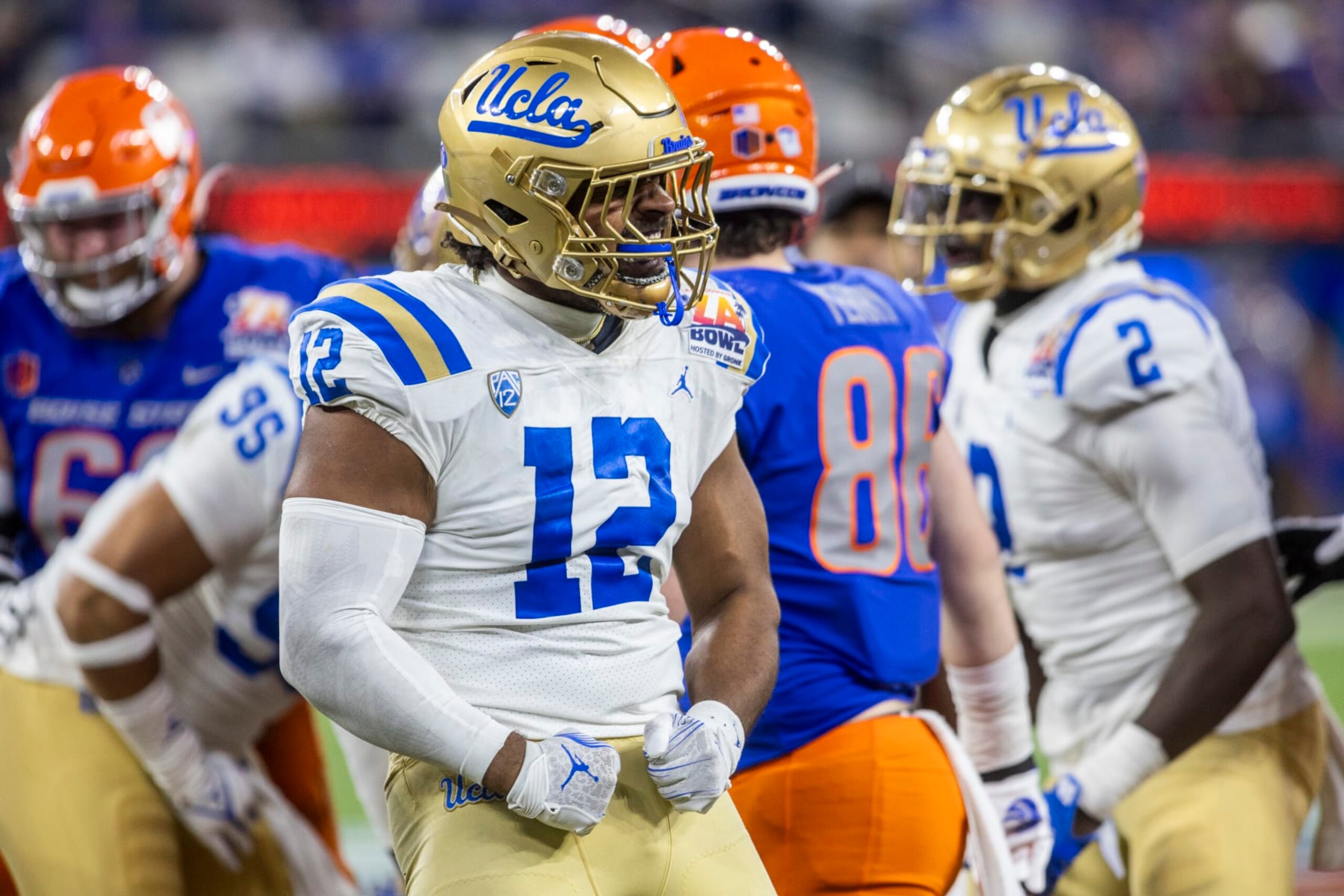 INGLEWOOD, CA - DECEMBER 16: UCLA defensive lineman Grayson Murphy (12) celebrates making a stop in the second half of the Starco Brands LA Bowl Hosted by Gronk, between the Boise State Broncos and UCLA Bruins, Saturday, December 16, 2023, at SoFi Stadium in Los Inglewood, California. (Photo by Tony Ding/Icon Sportswire via Getty Images)