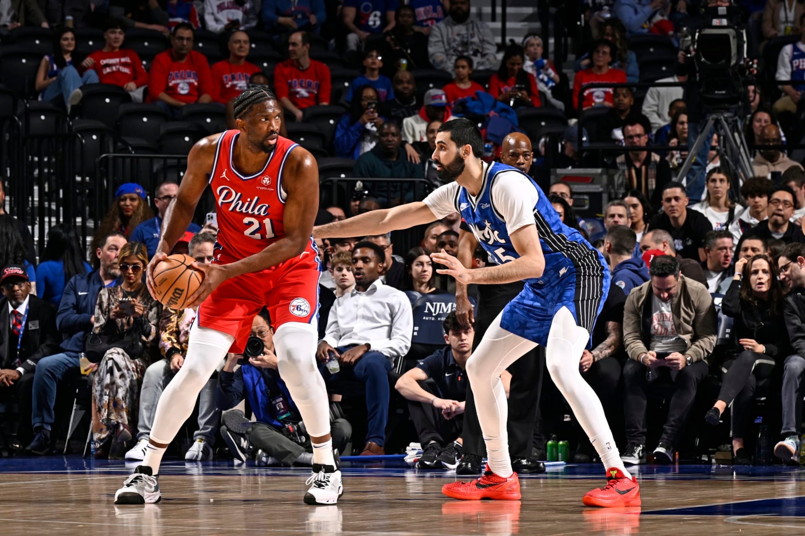 PHILADELPHIA, PA - APRIL 12: Joel Embiid #21 of the Philadelphia 76ers looks to pass the ball during the game against the Orlando Magic on April 12, 2024 at the Wells Fargo Center in Philadelphia, Pennsylvania NOTE TO USER: User expressly acknowledges and agrees that, by downloading and/or using this Photograph, user is consenting to the terms and conditions of the Getty Images License Agreement. Mandatory Copyright Notice: Copyright 2024 NBAE (Photo by David Dow/NBAE via Getty Images)