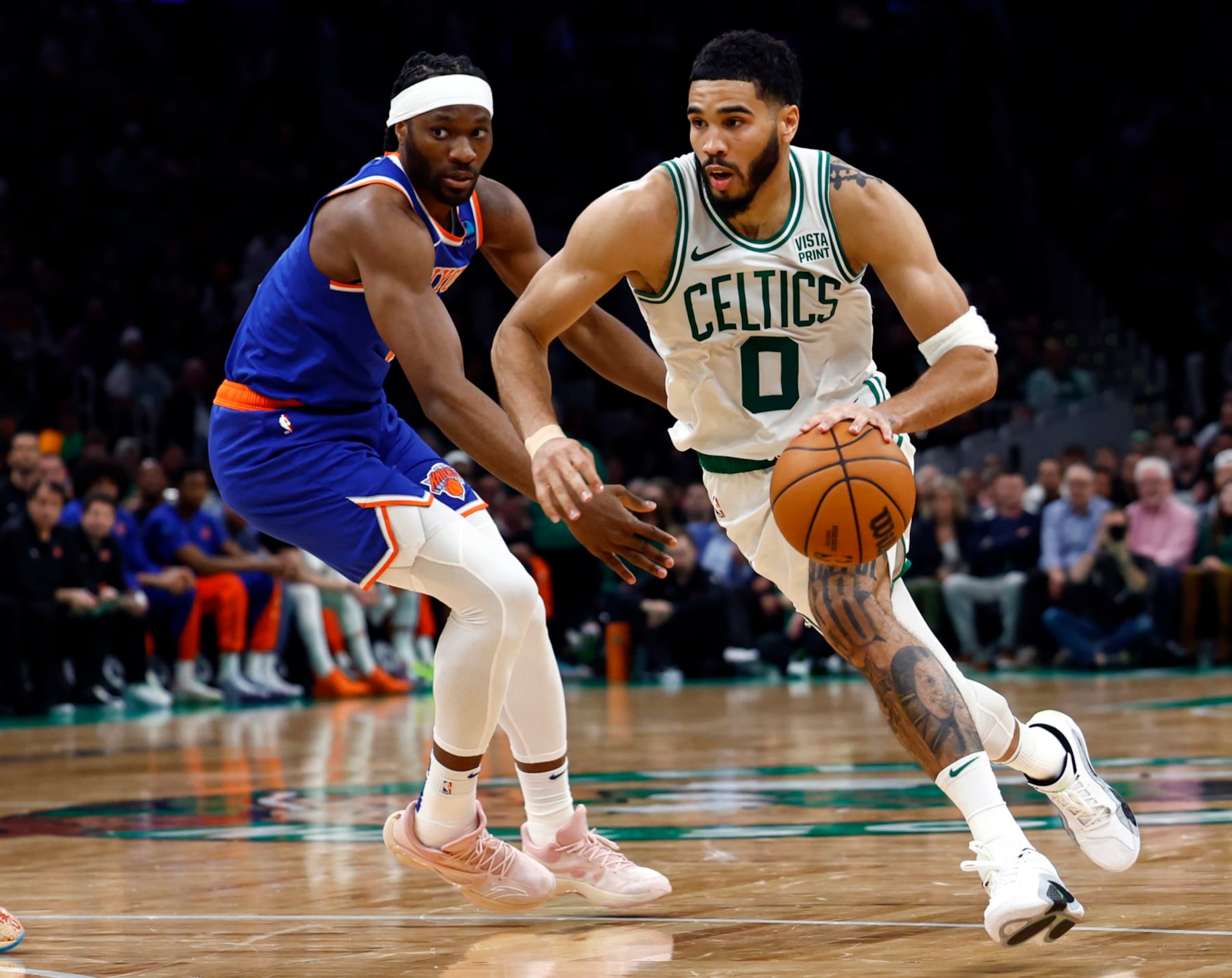 Boston, MA - April 11: Boston Celtics forward Jayson Tatum drives past New York Knicks forward Precious Achiuwa in the second quarter. (Photo by Danielle Parhizkaran/The Boston Globe via Getty Images) Boston, MA - April 11: Boston Celtics forward Jayson Tatum drives past New York Knicks forward Precious Achiuwa in the second quarter. (Photo by Danielle Parhizkaran/The Boston Globe via Getty Images)
