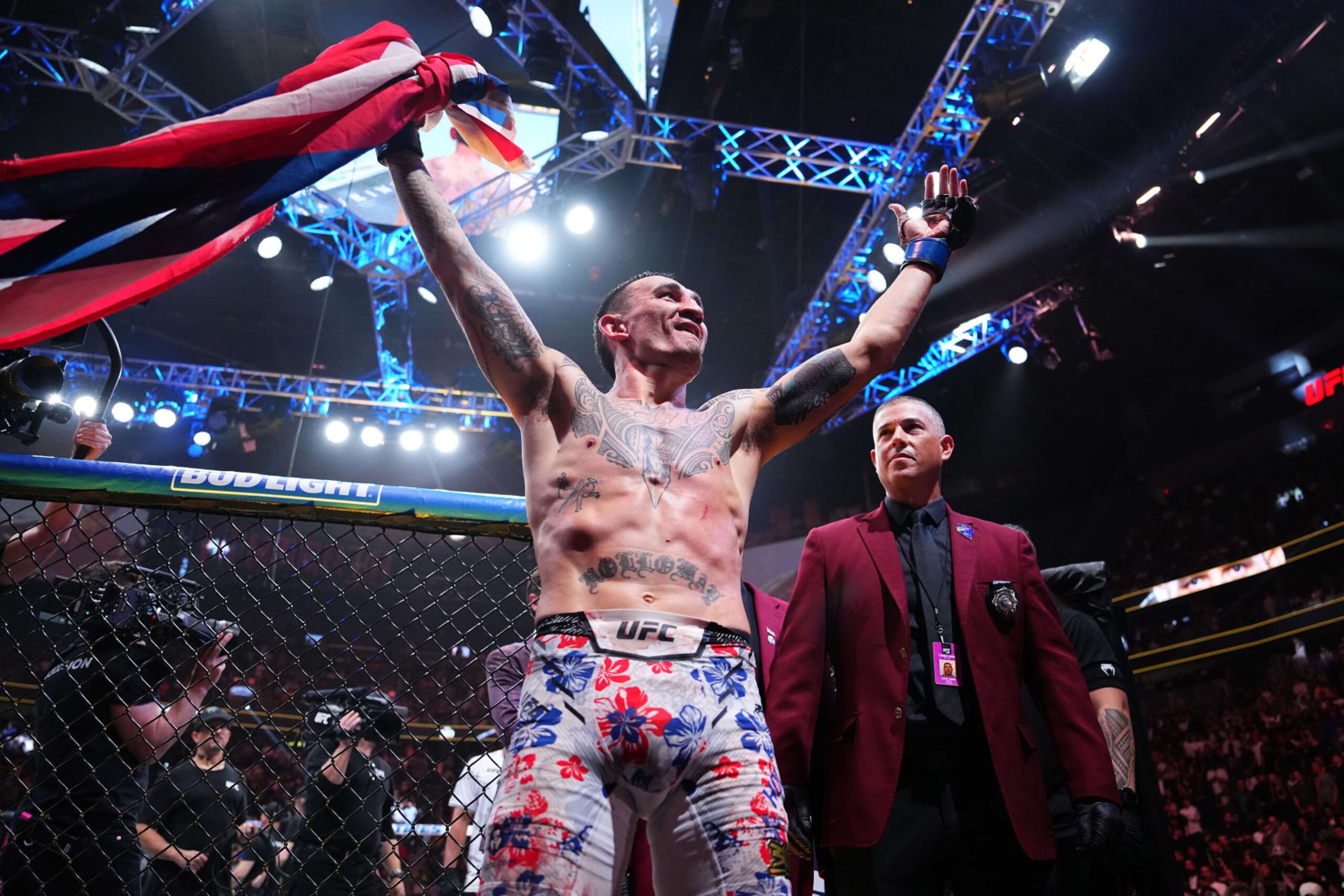 Max Holloway exits the Octagon after beating Justin Gaethje