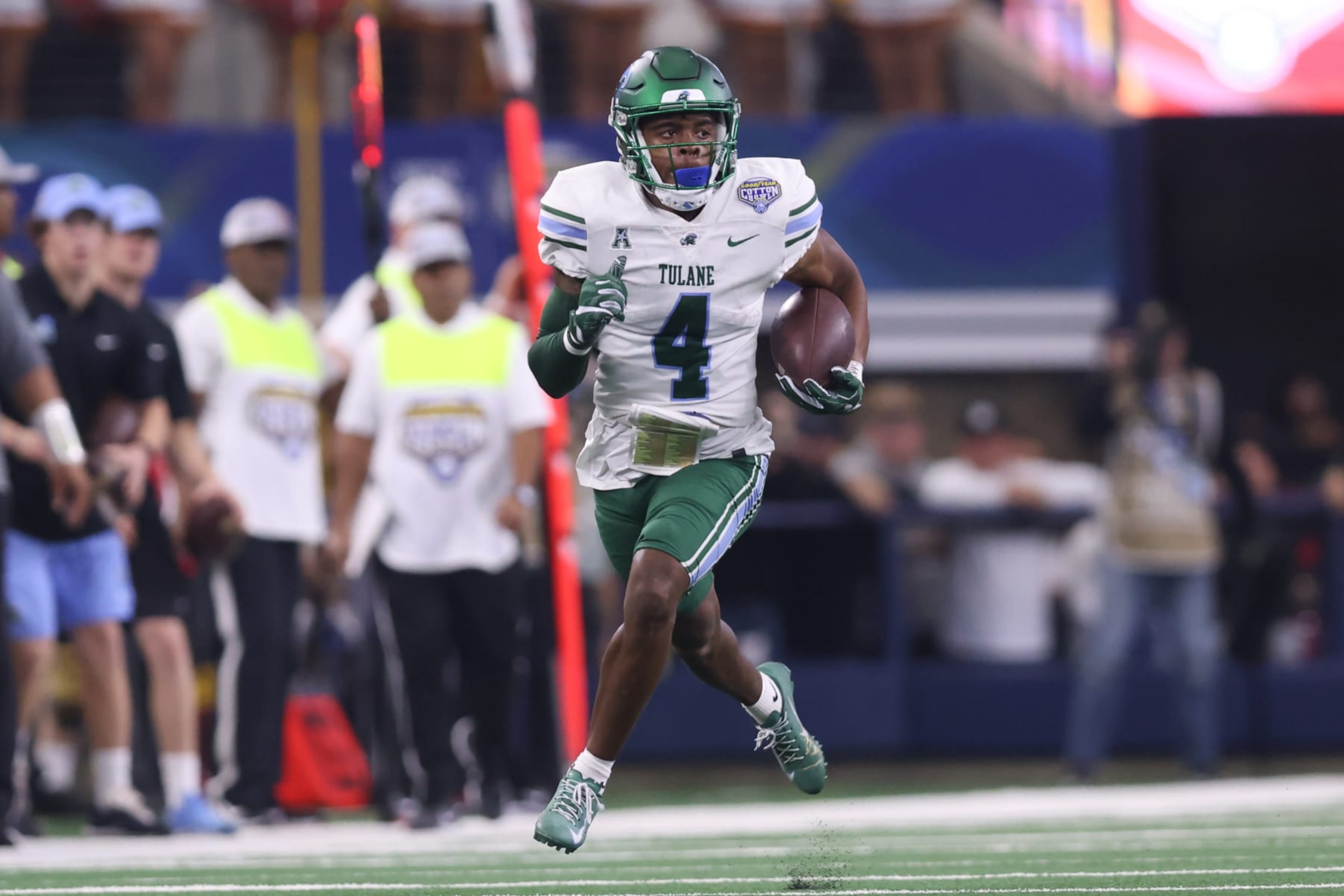 ARLINGTON, TX - JANUARY 02: Tulane Green Wave wide receiver Jha'Quan Jackson (4) carries the ball in the Goodyear Cotton Bowl between the USC Trojans and the Tulane Green Wave on January 2, 2023 at AT&T Stadium in Arlington, TX. (Photo by John Bunch/Icon Sportswire via Getty Images) ARLINGTON, TX - JANUARY 02: Tulane Green Wave wide receiver Jha'Quan Jackson (4) carries the ball in the Goodyear Cotton Bowl between the USC Trojans and the Tulane Green Wave on January 2, 2023 at AT&T Stadium in Arlington, TX. (Photo by John Bunch/Icon Sportswire via Getty Images)