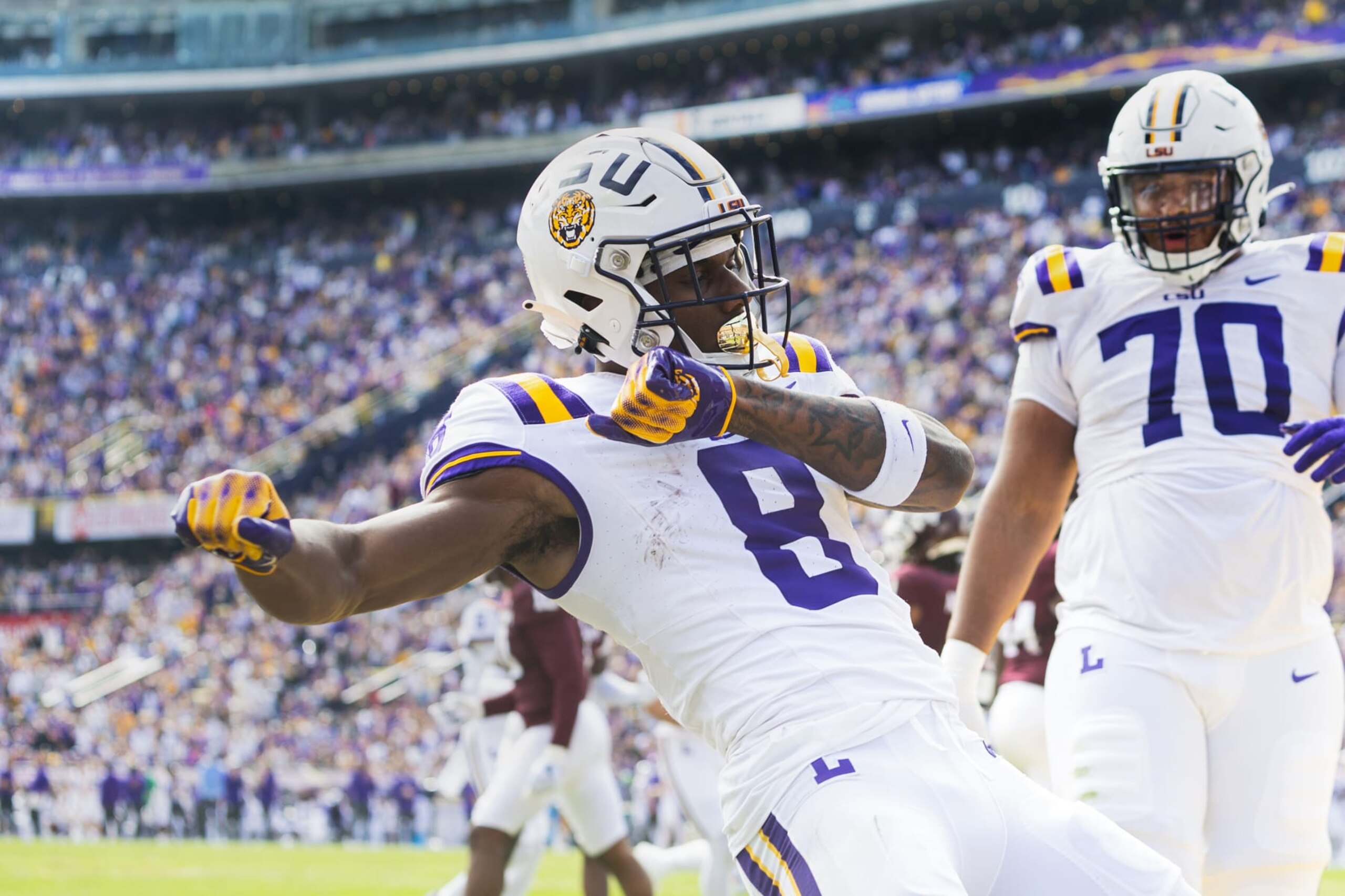 BATON ROUGE, LA - NOVEMBER 25: LSU Tigers wide receiver Malik Nabers (8) catches a pass during a game between the Texas A&M Aggies and the LSU Tigers in Tiger Stadium in Baton Rouge, Louisiana on November 25, 2023.(Photo by John Korduner/Icon Sportswire via Getty Images)