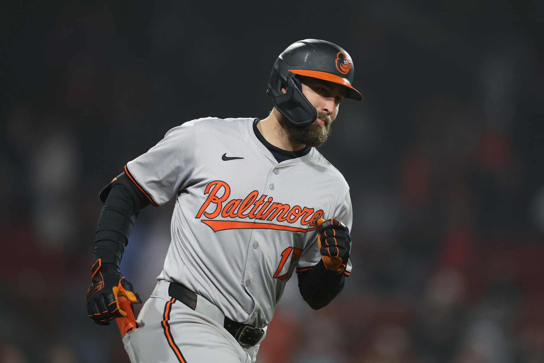 BOSTON, MASSACHUSETTS - APRIL 11: Colton Cowser #17 of the Baltimore Orioles runs to first during the tenth inning against the Boston Red Sox at Fenway Park on April 11, 2024 in Boston, Massachusetts. (Photo by Paul Rutherford/Getty Images)