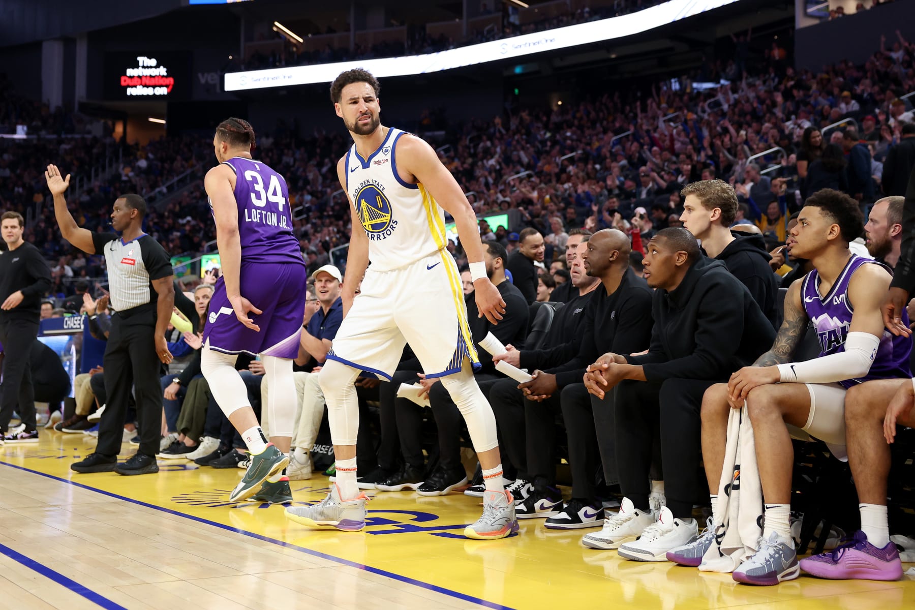 SAN FRANCISCO, CALIFORNIA - APRIL 14: Klay Thompson #11 of the Golden State Warriors looks back to the Utah Jazz bench after he made a basket in the first half at Chase Center on April 14, 2024 in San Francisco, California. NOTE TO USER: User expressly acknowledges and agrees that, by downloading and or using this photograph, User is consenting to the terms and conditions of the Getty Images License Agreement.  (Photo by Ezra Shaw/Getty Images)