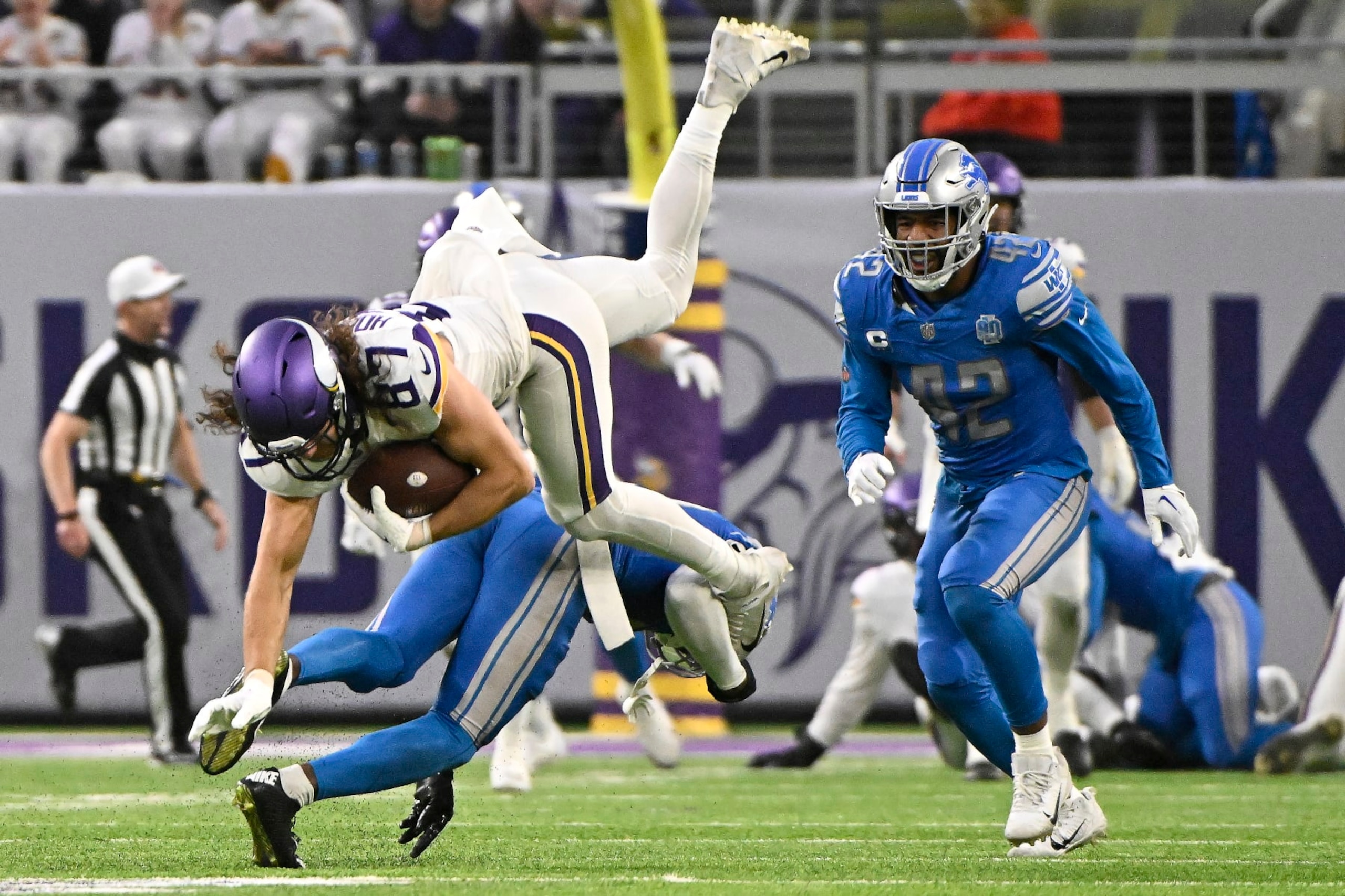 MINNEAPOLIS, MINNESOTA - DECEMBER 24: T.J. Hockenson #87 of the Minnesota Vikings is tackled by Kerby Joseph #31 of the Detroit Lions during the third quarter at U.S. Bank Stadium on December 24, 2023 in Minneapolis, Minnesota. (Photo by Stephen Maturen/Getty Images) MINNEAPOLIS, MINNESOTA - DECEMBER 24: T.J. Hockenson #87 of the Minnesota Vikings is tackled by Kerby Joseph #31 of the Detroit Lions during the third quarter at U.S. Bank Stadium on December 24, 2023 in Minneapolis, Minnesota. (Photo by Stephen Maturen/Getty Images)