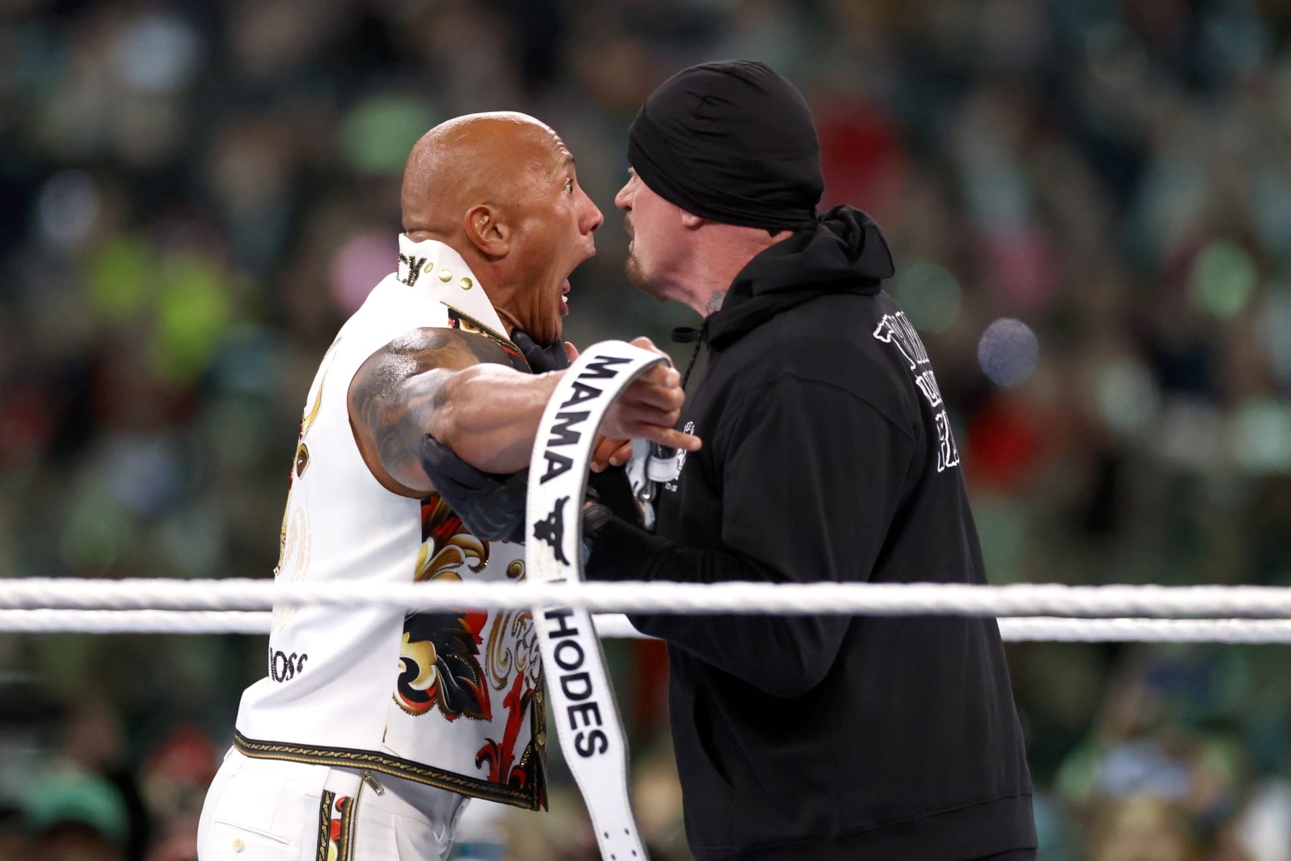 PHILADELPHIA, PENNSYLVANIA - APRIL 07: Dwayne "The Rock" Johnson fights against The Undertaker during Night Two at Lincoln Financial Field on April 07, 2024 in Philadelphia, Pennsylvania. (Photo by Tim Nwachukwu/Getty Images) PHILADELPHIA, PENNSYLVANIA - APRIL 07: Dwayne "The Rock" Johnson fights against The Undertaker during Night Two at Lincoln Financial Field on April 07, 2024 in Philadelphia, Pennsylvania. (Photo by Tim Nwachukwu/Getty Images)