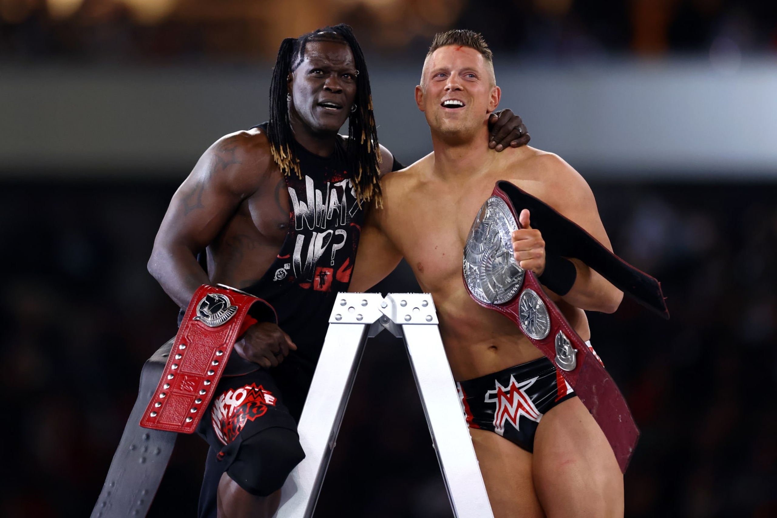 PHILADELPHIA, PENNSYLVANIA - APRIL 06: R-Truth and The Miz react after winning a six-pack tag team ladder match for the Undisputed WWE Tag Team Championship during Night One of WrestleMania 40 at Lincoln Financial Field on April 06, 2024 in Philadelphia, Pennsylvania.  (Photo by Tim Nwachukwu/Getty Images)