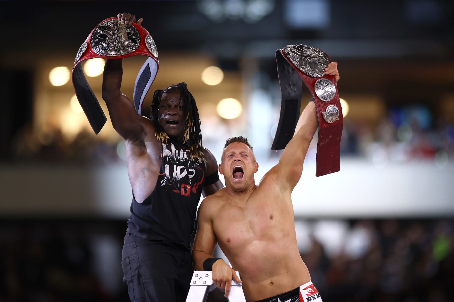 PHILADELPHIA, PENNSYLVANIA - APRIL 06: R-Truth and The Miz react after winning a six-pack tag team ladder match for the Undisputed WWE Tag Team Championship during Night One of WrestleMania 40 at Lincoln Financial Field on April 06, 2024 in Philadelphia, Pennsylvania.  (Photo by Tim Nwachukwu/Getty Images)
