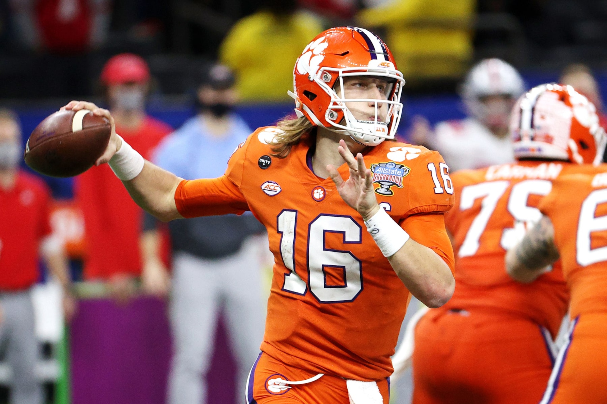 NEW ORLEANS, LOUISIANA - JANUARY 01: Trevor Lawrence #16 of the Clemson Tigers passes against the Ohio State Buckeyes in the second half during the College Football Playoff semifinal game at the Allstate Sugar Bowl at Mercedes-Benz Superdome on January 01, 2021 in New Orleans, Louisiana. (Photo by Chris Graythen/Getty Images)