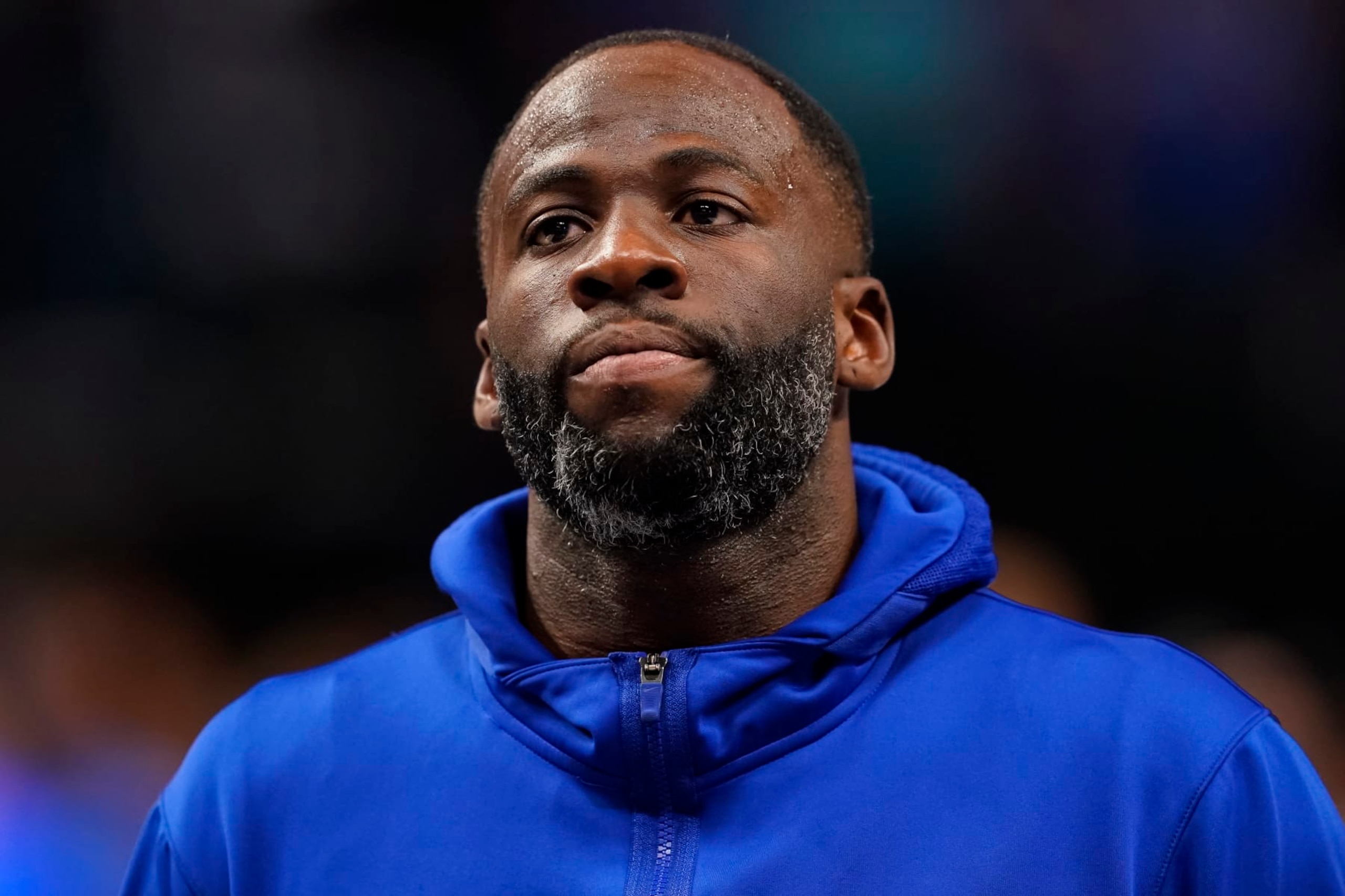 DALLAS, TEXAS - APRIL 05: Draymond Green #23 of the Golden State Warriors looks on during the playing of the U.S. national anthem before the game against the Dallas Mavericks at American Airlines Center on April 05, 2024 in Dallas, Texas. NOTE TO USER: User expressly acknowledges and agrees that, by downloading and or using this photograph, User is consenting to the terms and conditions of the Getty Images License Agreement. (Photo by Sam Hodde/Getty Images)