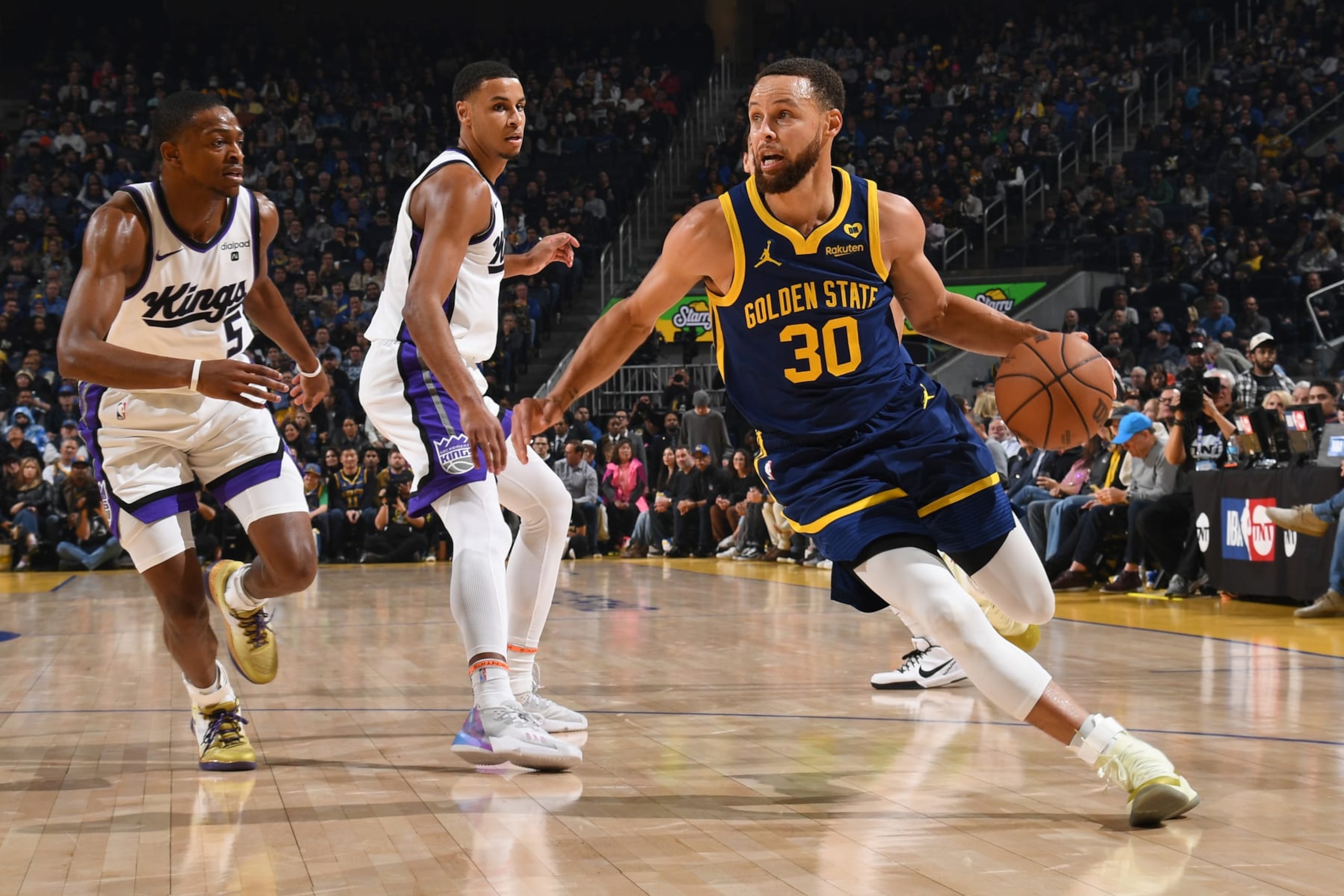 SAN FRANCISCO, CA - JANUARY 25: Stephen Curry #30 of the Golden State Warriors dribbles the ball during the game against the Sacramento Kings on January 25, 2024 at Chase Center in San Francisco, California. NOTE TO USER: User expressly acknowledges and agrees that, by downloading and or using this photograph, user is consenting to the terms and conditions of Getty Images License Agreement. Mandatory Copyright Notice: Copyright 2024 NBAE (Photo by Noah Graham/NBAE via Getty Images) SAN FRANCISCO, CA - JANUARY 25: Stephen Curry #30 of the Golden State Warriors dribbles the ball during the game against the Sacramento Kings on January 25, 2024 at Chase Center in San Francisco, California. NOTE TO USER: User expressly acknowledges and agrees that, by downloading and or using this photograph, user is consenting to the terms and conditions of Getty Images License Agreement. Mandatory Copyright Notice: Copyright 2024 NBAE (Photo by Noah Graham/NBAE via Getty Images)