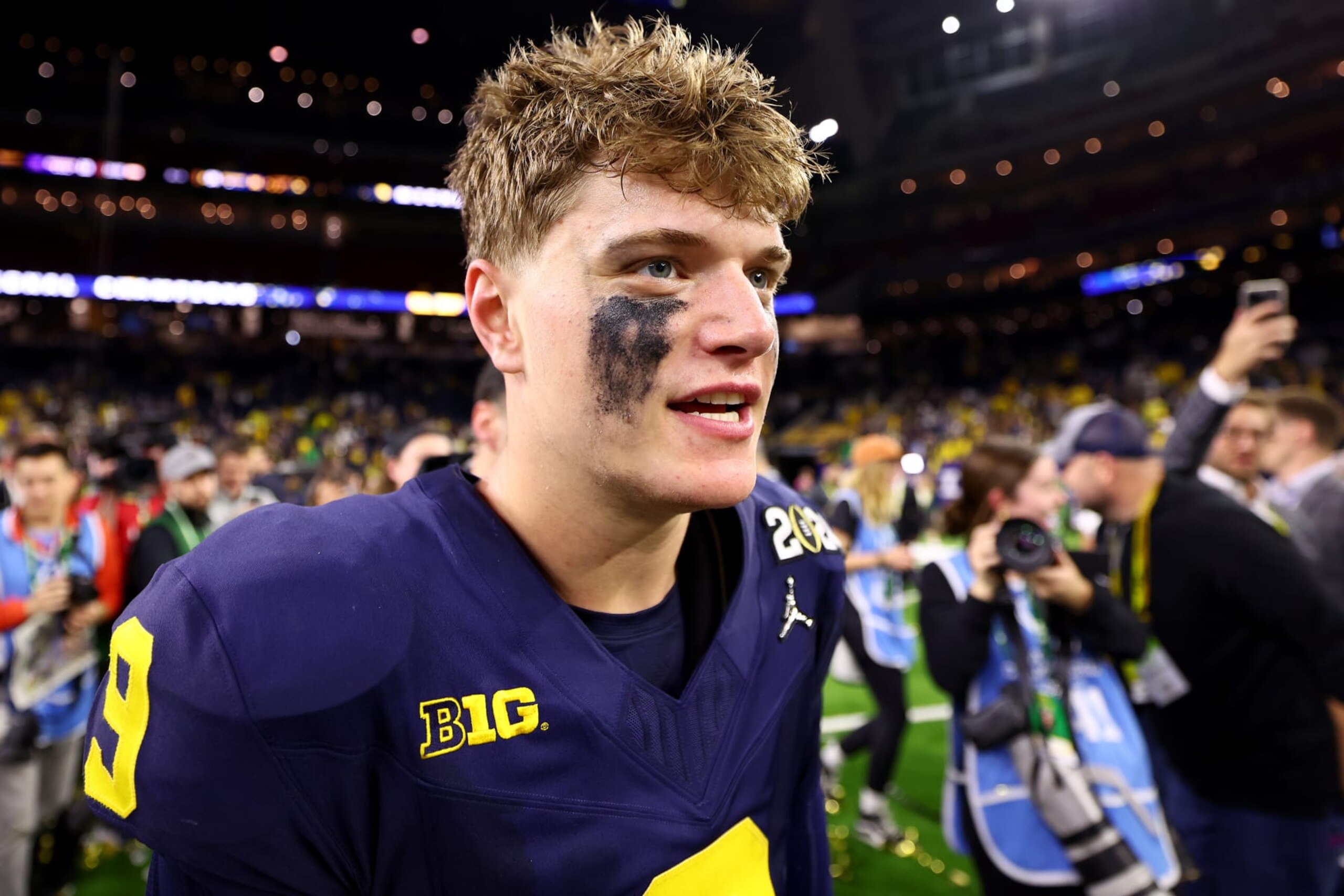 HOUSTON, TEXAS - JANUARY 8: J.J. McCarthy #9 of the Michigan Wolverines celebrates their victory over the Washington Huskies during the 2024 CFP National Championship game at NRG Stadium on January 8, 2024 in Houston, Texas. (Photo by Jamie Schwaberow/Getty Images)