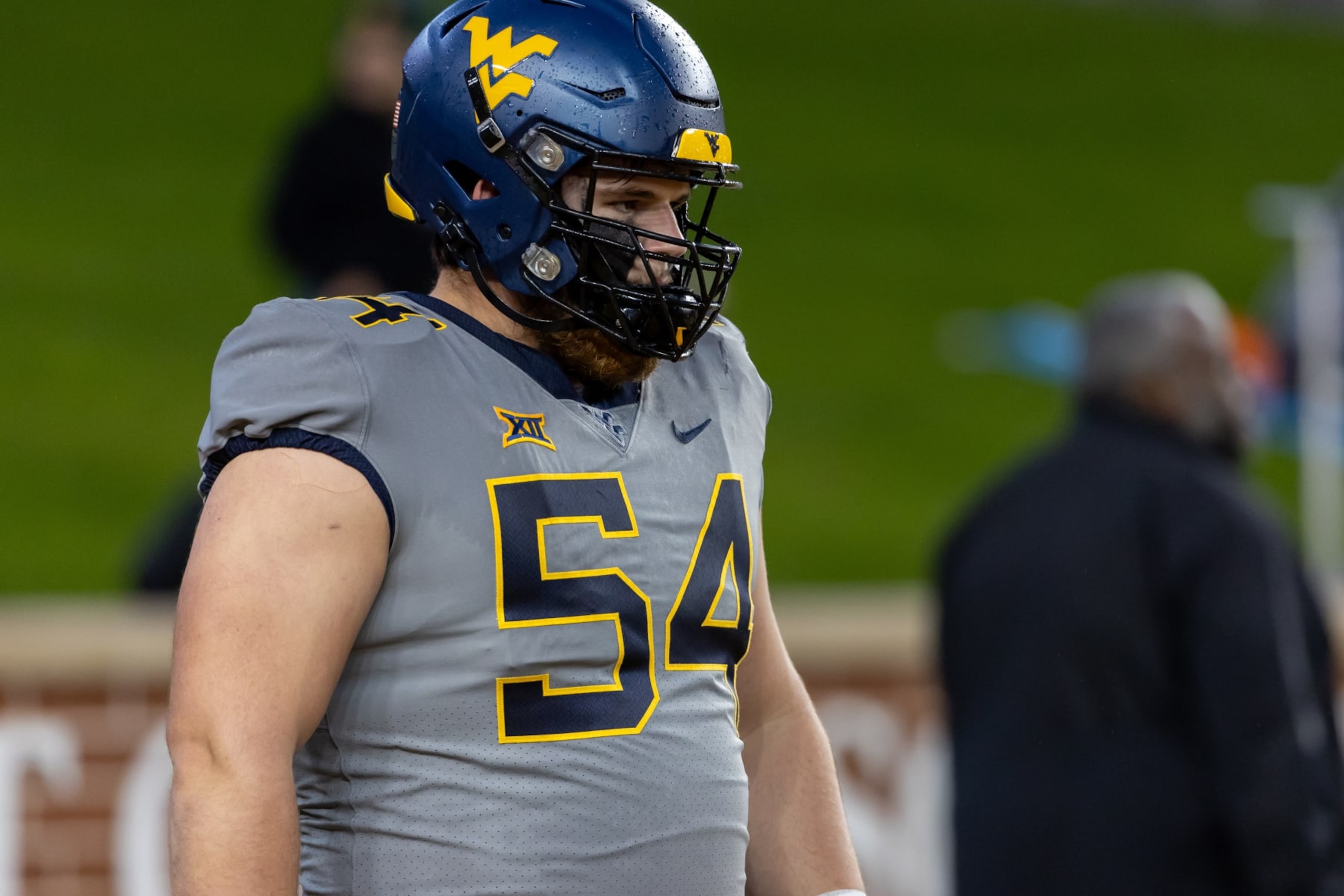 WACO, TX - NOVEMBER 25: West Virginia Mountaineers offensive lineman Zach Frazier (54) on the field for warm ups before the Big 12 college football game between Baylor Bears and West Virginia Mountaineers on November 25, 2023, at McLane Stadium in Waco, TX. (Photo by David Buono/Icon Sportswire via Getty Images) WACO, TX - NOVEMBER 25: West Virginia Mountaineers offensive lineman Zach Frazier (54) on the field for warm ups before the Big 12 college football game between Baylor Bears and West Virginia Mountaineers on November 25, 2023, at McLane Stadium in Waco, TX. (Photo by David Buono/Icon Sportswire via Getty Images)