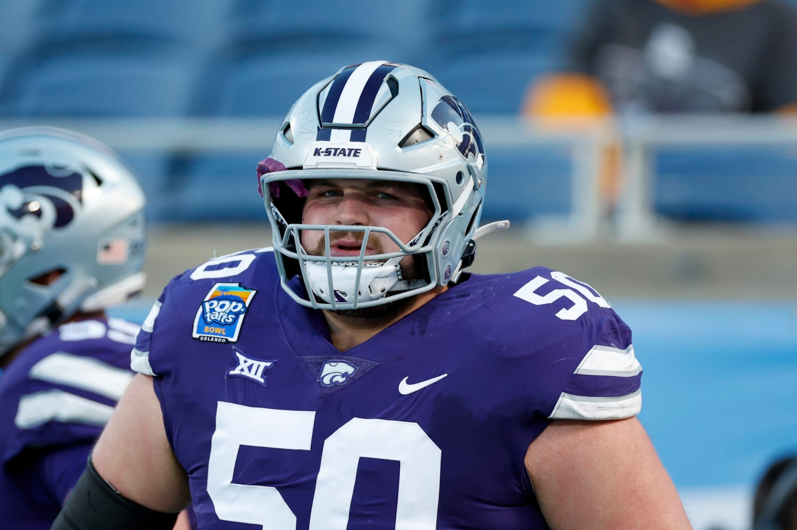 ORLANDO, FL - DECEMBER 28: Kansas State Wildcats offensive lineman Cooper Beebe (50) looks on before the game between the North Carolina State Wolfpack and the Kansas State Wildcats on December 28, 2023 at Camping World Stadium in Orlando, Fl. (Photo by David Rosenblum/Icon Sportswire via Getty Images)