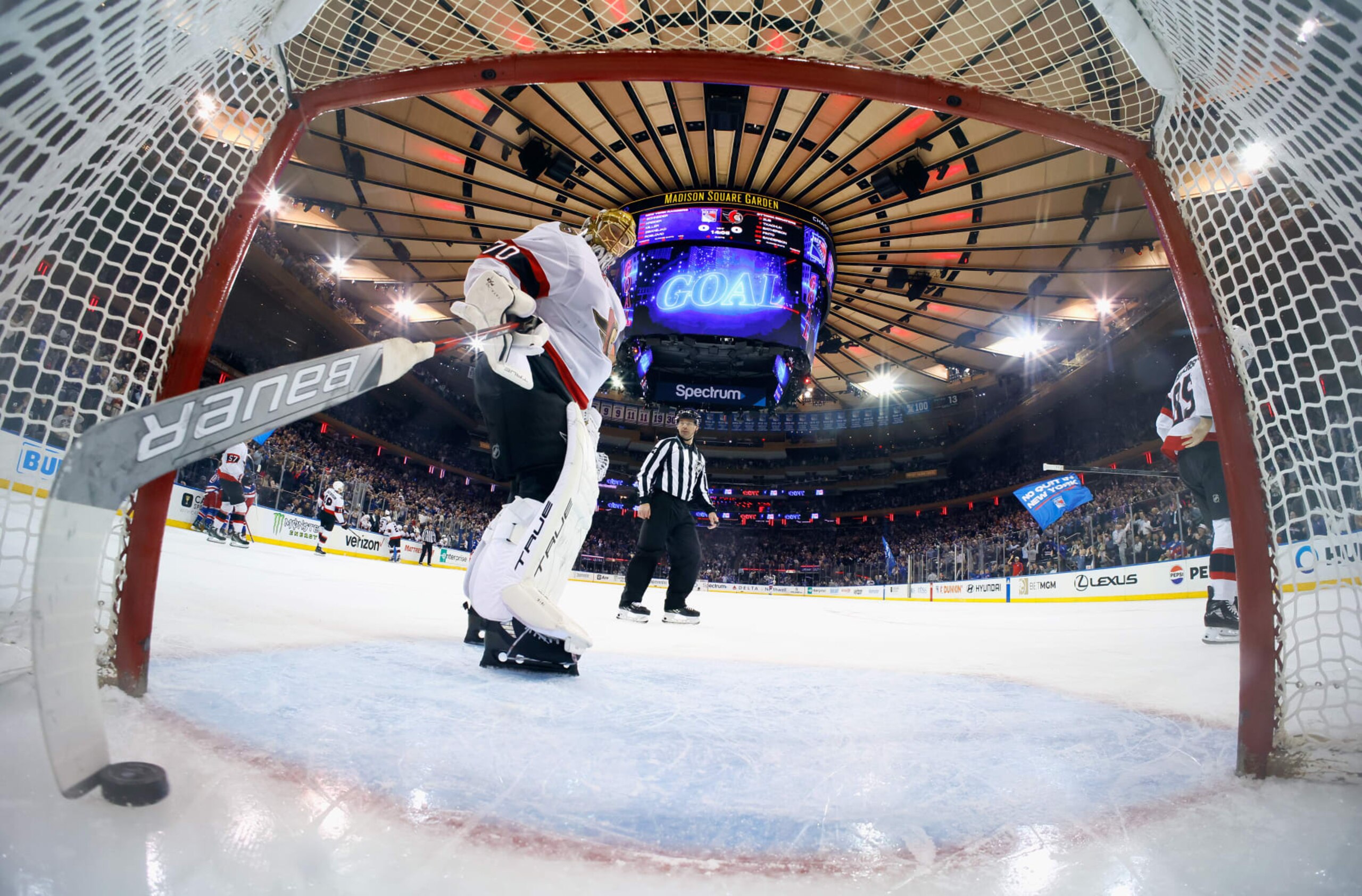 NEW YORK, NEW YORK - APRIL 15: Joonas Korpisalo #70 of the Ottawa Senators fishes the puck out of the net following the first goal of the game against the New York Rangers at Madison Square Garden on April 15, 2024 in New York City. The Rangers shut out the Senators 4-0. (Photo by Bruce Bennett/Getty Images)